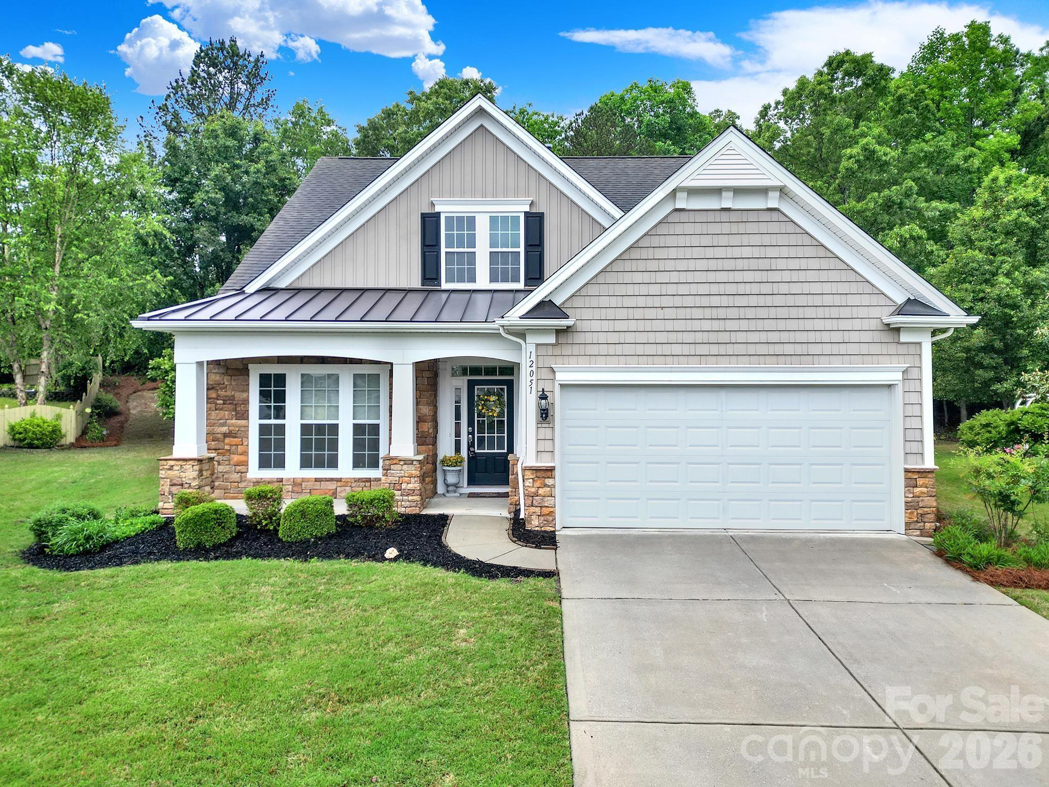 Expect to be impressed by this impeccably maintained home in desirable Belair! This home is a true gem situated on an incredibly rare, private homesite, surrounded by trees and woods on an oversized cus-de-sac lot. This 1.5 story home boasts 3 bedrooms, 3 full baths plus a large loft and screened porch overlooking the wooded backyard. Loaded with upgrades from the minute you walk in, including gleaming prefinished hardwoods in the main living areas, crown molding & wainscoating. The kitchen features granite countertops, stainless appliances, tile backsplash and a center island, perfect for entertaining. Recessed lighting and a picture window allow for bright natural light and opens up to a true vaulted living room space, highlighted by a gas log fireplace w/mantle. The primary suite on the main level has a tray ceiling, ensuite w/ dual vanities, shower, and large walk-in closet. There is a second suite on the main level with a full bathroom. Upstairs boasts a loft, spacious bedroom with walk-in closet, linen closet, storage closet and a full bathroom, perfect for guests. Enjoy sitting on the cozy screened-in porch or relax & unwind for the day while lounging on the extended paver patio. This home is surrounded by lush, mature landscaping. Notable updates include freshly painted, HVAC & Furnace - 2023, Hot water heater - 2020. Community offers Clubhouse, pool, playground, sidewalks and is conveniently located to local shopping, grocery, restaurants and so much more. Lawn Maintenance provided in this section, "The Court", of Belair at Carolina Lakes.