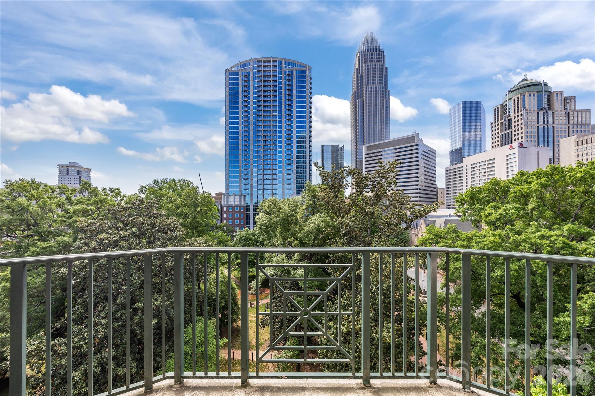 If you’ve Dreamed of owning a Condo at One of Fourth Ward’s Most Prestigious Addresses…at AN INCREDIBLE PRICE, Your Opportunity Is Here! This spacious and updated 2-bedroom, 2-bath home at the highly sought-after Fifth & Poplar stands out with its outstanding city skyline balcony view with NO unit above. Expansive living room windows frame stunning views of the lush green landscape of Fourth Ward Park. Open floorplan features a gallery styled kitchen with granite countertops and spacious living room with rich hand-scraped engineered hardwood floors. Split floorplan with each bedroom has its ensuite bathroom. One of the bathrooms is fully updated. Both walk-in closets are customized! NEW LVP floorings in both bedrooms (2025). Newer HVAC 2020, Newer Water Heater 2020. The entire home has been professionally painted. Fridge and Stackable Washer Dryer convey. Truly move-in ready! Enjoy the perfect balance of vibrant city living and the charm of historic, tree-lined Fourth Ward—just moments from the area’s best theaters, dining, music, film, and sporting events. Then retreat to the gated community, where resort-style amenities offer the ultimate in comfort, relaxation, and convenience. Fifth & Poplar Sets The Standard in Uptown Living With Its Unparalleled Amenities: 24/7 CONCIERGE & AWARD WINNING ON SITE HOA management., pool w outdoor kitchen, professionally landscaped gated courtyard w putting green, fountain, dog park, state-of-art fitness center, cozy library w gas fireplace, fireside terrace w TV & grills, media room, cyber & coffee cafes& resident car wash. 2 full time supers & maintenance staff, HARRIS TEETER, NAIL SALON & DRY CLEANERS in the building. Secured parking of course and social calendar. Truly the Ultimate In Luxury Living… Book your showing today before this one gets away!