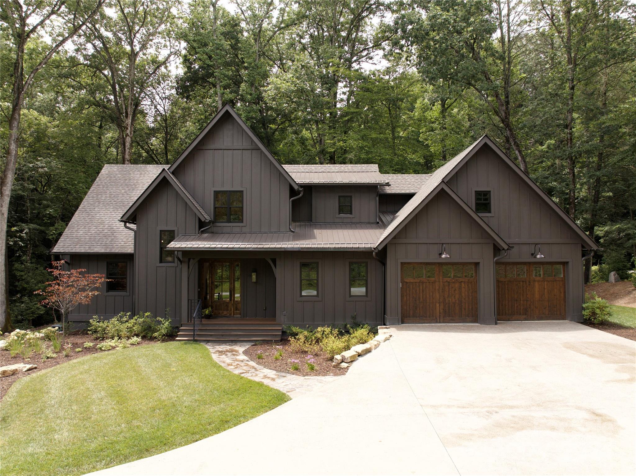 Welcome to 299 Mountain Brook Trail! An entertainers delight, this newly constructed modern craftsman in the Mountain Brook Community boasts an eye-catching exterior façade, spacious covered deck with exterior fireplace, open floor plan, and custom features throughout. A beautiful blend of modern luxury and mountain tranquility, this home features a master suite on main, chef's kitchen with luxury quartz countertops, custom inset cabinetry, and Fisher & Paykel appliances. You will also find custom-built closets, Italian porcelain tile and leathered quartz in master bath, custom designer lighting and plumbing fixtures, along with Knotty Alder front doors and 6" white oak flooring. Central Vac, Trane high efficiency heat pump, encapsulated climate controlled crawlspace and tankless water heaters. No detail was spared or overlooked in this peaceful mountain oasis that is conveniently located just minutes to downtown Brevard, hiking, mountain biking, fishing and exploring beautiful WNC!