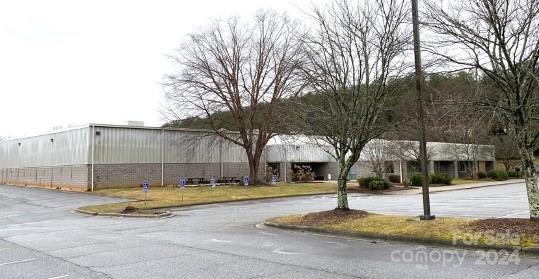 Immaculately maintained 51,271sf warehouse (33,000sf fully conditioned) on 4.5 acres in prime location.  Formerly occupied by Ocean-X.  3,336/sf of office space with 160 parking spaces.  New 20-year roof.  

Prominent, readily accessible location (signalized) fronting Brevard Rd.  Close to the Long Shoals intersection.  At the entrance to The Cliffs Walnut Cove.  Opposite the Borg Warner corporate campus.  

Parking and drives re-paved.  Exceptional value for a turnkey Class A facility in this location.  Priced well below replacement cost.

Available for lease at $9.50/sf NNN.