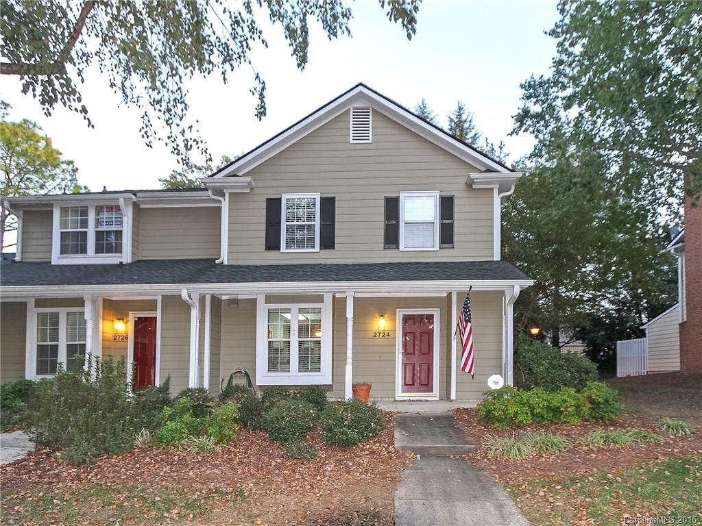 Covered front porch,, End unit with renovated kitchen, custom backsplash, custom storage in breakfast bar, private patio/retractable umbrella remains w/property, fenced. Storage outside. Custom shelving in living room.