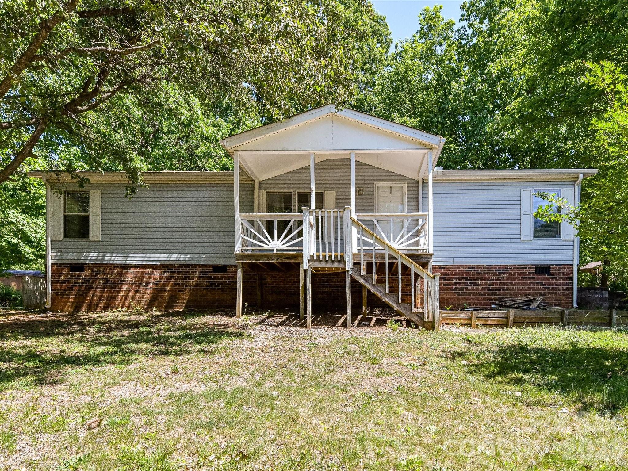 Set on a generous 3/4 acre homesite, this single-level home offers space, privacy, and everyday convenience in an established community with no HOA (there are CCRs). Enjoy peaceful outdoor living from two covered porches that take in the serene surroundings. The location is ideal for commuters, with easy access to Hwy 16.  The home has a split bedroom floor plan, with the primary and ensuite on one side and the two secondary bedrooms and second full bath on the other.  Additional highlights include a detached storage shed and a covered area for lawn equipment, providing practical solutions for tools and outdoor gear. Major updates have already been taken care of, including a roof replacement in 2016, gutters in 2019, and a well pump and pressure tank installed in 2014. Zoned for Balls Creek and Bandys schools, this home is ready for its next owner.  Corner lot.