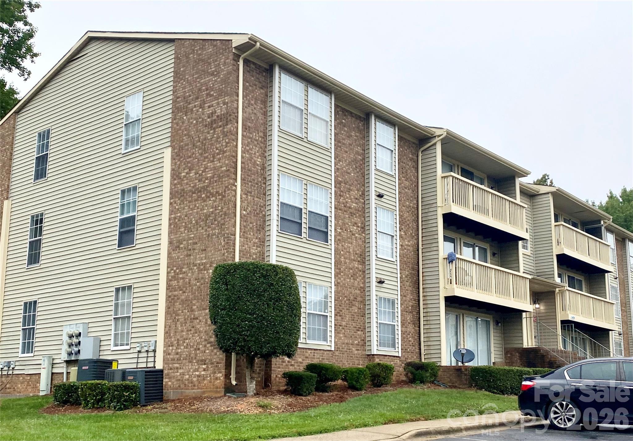 Beautifully updated 3BR/2BA third-floor condo in a prime UNC Charlotte location! This open-concept floor plan features a spacious living/dining area and galley kitchen with modern gray cabinetry, Whirlpool stainless steel appliances, New Caledonia granite countertops, and a raised breakfast bar. Recent updates include luxury vinyl plank flooring, neutral paint, recessed lighting, six-panel doors, and renovated bathrooms with tiled showers, updated lighting, and mirrors. Ample closet and storage space throughout. Full-size stacked washer and dryer convey. Brand-new HVAC system provides added value and peace of mind.

Located in a well-maintained community with a single entrance and surveillance cameras. Excellent investment opportunity with tenant in place paying $1,450/month through March 3, 2027. No rental cap; HOA requires a minimum lease term of six months. Convenient to UNC Charlotte, shopping, dining, major employers, and interstates.