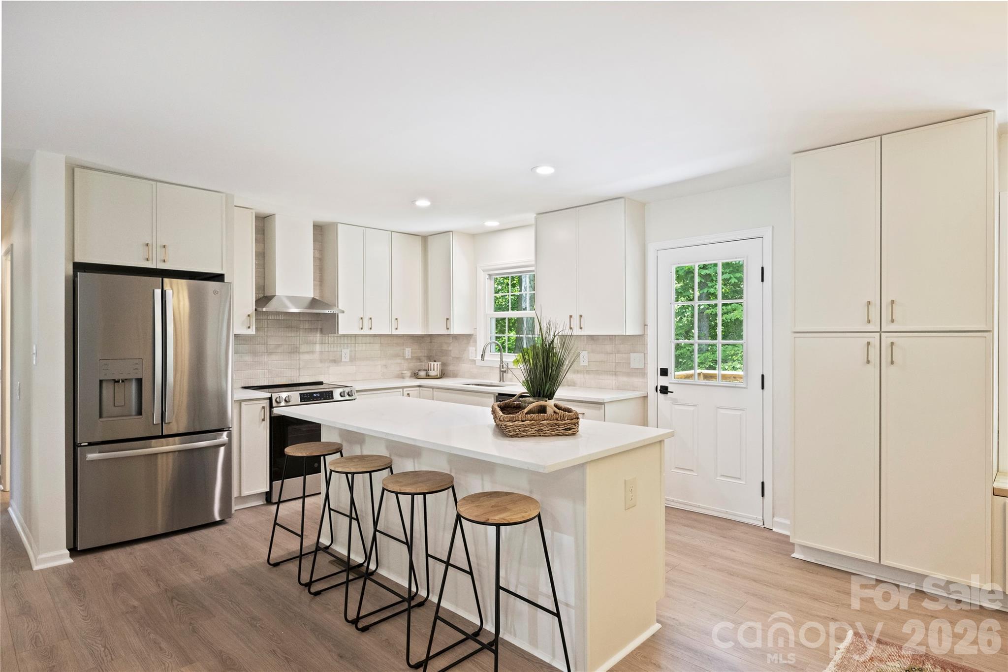 Completely remodeled and ready to impress, this stunning home offers 4 bedrooms, 3 full baths, and a seamless blend of style and functionality. From the moment you step inside, you’ll be captivated by the open floorplan, designed to make both daily living and entertaining a breeze. The heart of the home is the chef’s kitchen, boasting a spacious island, sleek quartz countertops, brand-new stainless steel appliances, and a dining space with built-ins that provide ample storage. The main level features three beautifully appointed bedrooms and two full baths, each showcasing chic, on-trend vanities that add a touch of modern elegance. Upstairs, one of the bedrooms includes an ensuite bath—perfect for guests or a second primary. Downstairs, the second living area exudes charm with its moody palette and cozy fireplace, the perfect spot to relax and unwind. The expansive primary suite is a true sanctuary, complete with a large walk-in closet, a stunning ensuite bath featuring a fluted dual-sink vanity, a glass walk-in shower, and an adjacent flex space ideal for a home office or gym. Step out onto the serene deck overlooking a peaceful, wooded backyard that feels like your own mountain escape. Whether you’re sipping your morning coffee or unwinding in the evening, this outdoor space is pure tranquility. Nestled in the established Heritage Woods neighborhood, this home is centrally located between Matthews and Cotswold and just minutes from Uptown Charlotte. Plus, it’s in the coveted Private School Corridor, close to some of the city’s top-rated schools. With fully updated finishes, thoughtful design, and an unbeatable location, this home offers incredible value for modern living in Charlotte. Don’t miss your chance to make it yours!