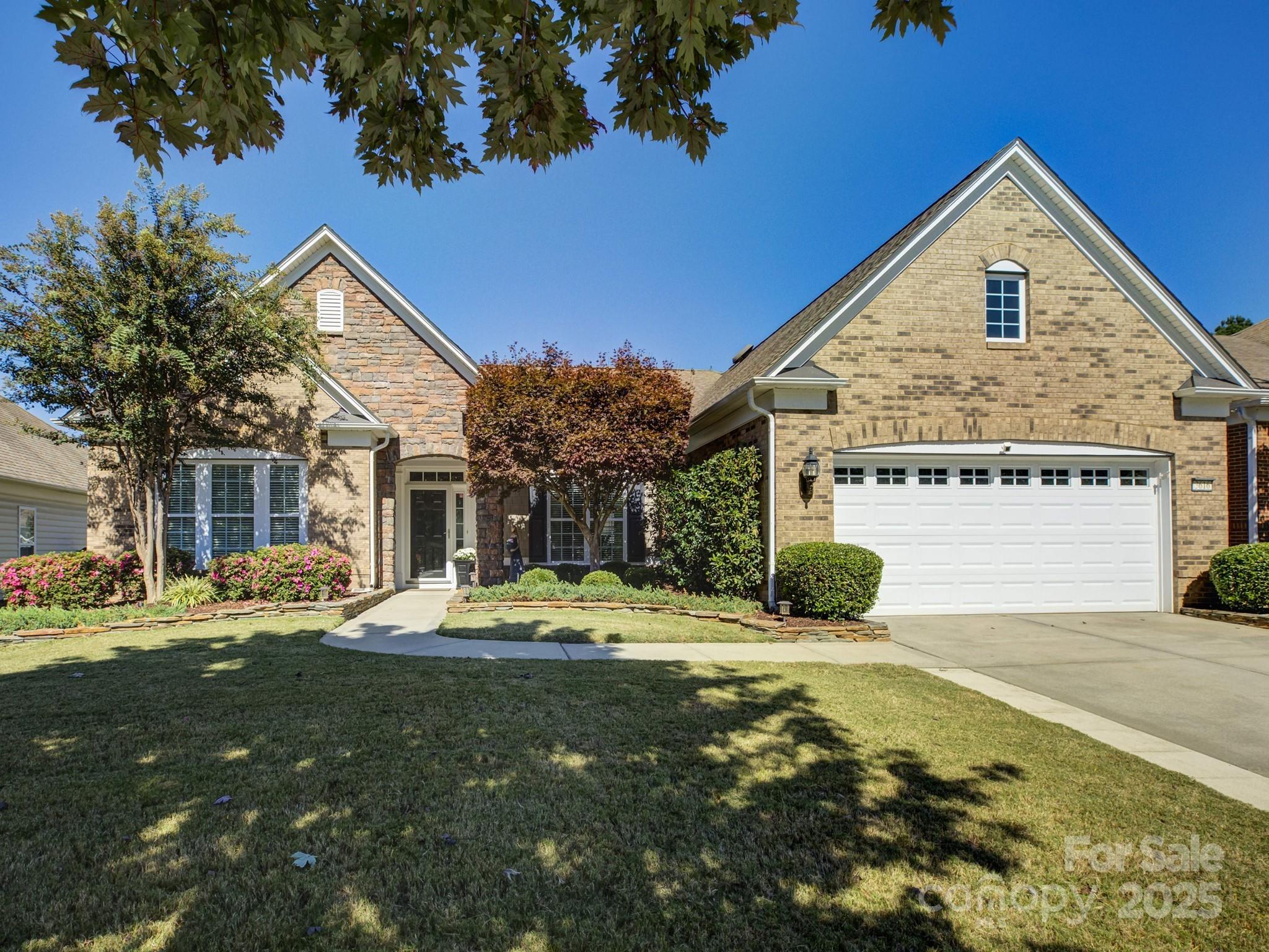 Welcome to the gold standard of active adult neighborhoods, picturesque Sun City Carolina Lakes! The is the stunning and sought-after Chestnut Garden plan you have been waiting for! Excellent location nestled on a quiet street with a park view directly across the street AND close to an entrance providing the conveniences of thriving Indian Land at your fingertips. This property offers a rare blend of community living and natural beauty! Inside is light, bright, and open with pre-finished wood floors gracing the main living areas and the primary bedroom! A versatile office with elegant French doors offers the ideal space for a study or a cozy second living area. The tranquil primary suite offers a peaceful retreat, featuring a tray ceiling, sitting area, practical drop zone, and a spa-inspired ensuite bath with dual vanities, a soaking tub, a glass-enclosed shower, and a generous walk-in closet! The lovely kitchen has plenty of cabinet space, an island, and breakfast bar. And don't miss the rare, spacious sunroom and screened porch! Outside, you will find an exceptional living space, complete with a huge paver patio, sitting wall, and retractable awning. Just perfect for enjoying our Carolina weather with friends and neighbors! Remarkable and meticulously maintained home. Sun City has resort-style amenities: 18 hole golf course, miles of walking trails, indoor and outdoor pools, kayaking, softball, woodworking shop, a dog park, tennis, pickleball, gardening, pottery and countless opportunities for an active lifestyle! Do not miss this home!
