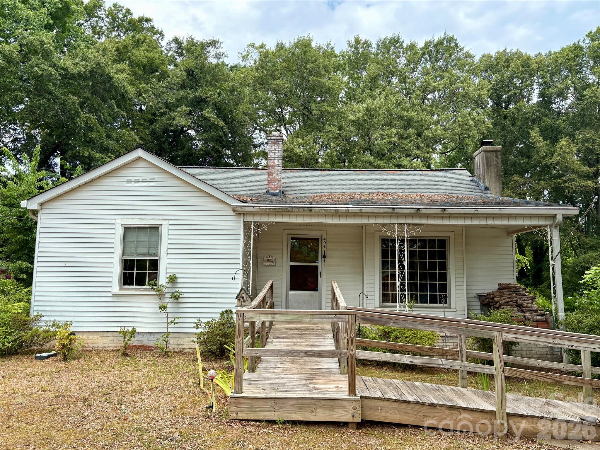 Just hit the market and has SO much potential! Come live, work and play near the ongoing activities and revitalization throughout Cleveland County to include the nearby Two Kings Casino development! This 2/1 ranch home is just beaming with possibilities!! It has a third bedroom that just needs the doors added to make it official~ over 1300 square feet of living space with the real deal hardwood floors, wood burning fireplace in the living room plus a Brand New HVAC system in 2025! This property would be ideal and budget friendly for those not wanting to rent anymore or for investors and/or flippers alike. Did I say SO much potential? City water and sewer with Shelby, lovely covered front porch for relaxing and taking a tea break, wheelchair ramp/ home is partially handicap accessible, a small, but wired storage shed out back to convey AS IS. This Home provides easy access to all that Shelby has to offer ~ Great Location within a mile or so from Hwy 74 and a few minutes to Uptown Shelby where you can visit the Farmer's Market, cafe's, shopping, restaurants, etc. But all the while still offering a quaint neighborhood feel. New construction is just about 4-5 houses down from this one priced at $289K! All this Home needs is You and Your Decorative Vision. Come see it today! (Final Belongings in the Home will be removed prior to closing. Refrigerator does not stay but the washer and dryer does.)