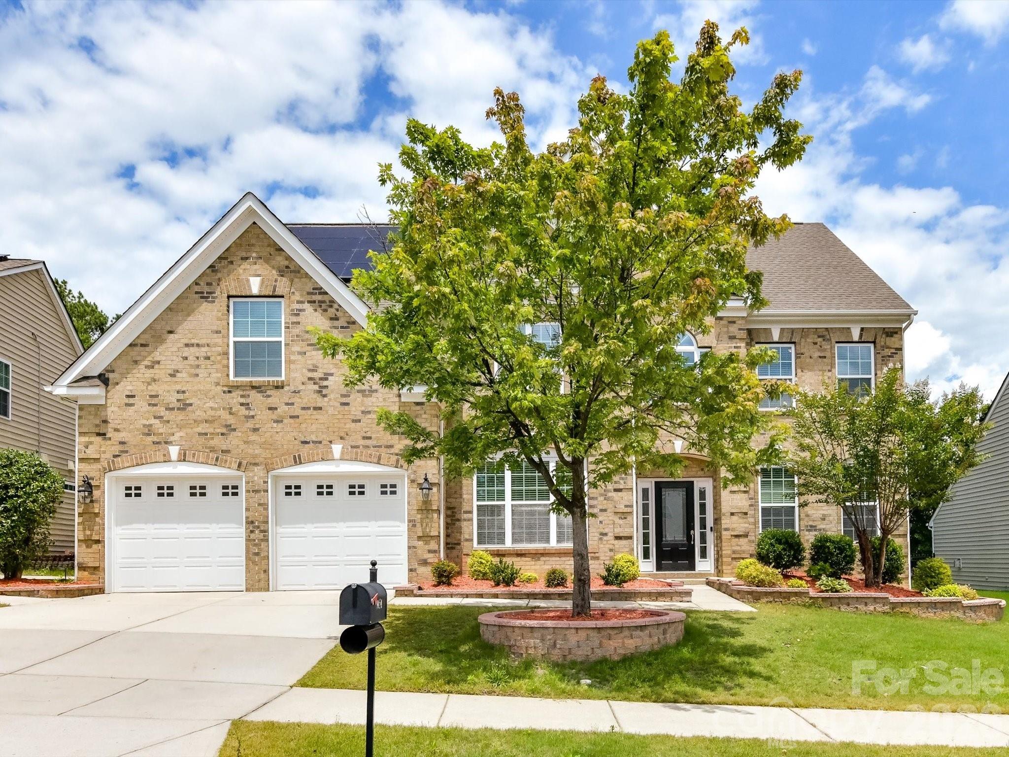 Welcome to 9154 Perseverance Drive, a stunning former model home in Harrisburg that perfectly blends luxury, efficiency, and an entertainer's lifestyle. Inside, the home has been freshly painted and features beautiful luxury vinyl plank flooring across all levels. Every room is illuminated with modern recessed lighting and equipped with a built-in speaker system, creating an inviting and tech-savvy atmosphere. The kitchen features a brand-new stove with a dedicated vent hood, while the temperature-controlled garage stands out with pristine epoxy floors and custom built-in storage. Built for ultimate peace of mind and low utility costs, the home is equipped with solar panels, a tankless water heater, a Tesla charger and a newer HVAC system, 2 units are 2024. Step outside into your own private oasis: a fully fenced backyard lined with mature privacy trees, an in-ground irrigation system, and an expansive paver patio complete with a built-in outdoor kitchen and firepit. Residents enjoy top-tier community amenities including a resort-style pool, cabana, playground, and beach volleyball courts, all while being minutes away from I-485, local shopping, dining, groceries, and the scenic trails of Reedy Creek Park and Harrisburg Park, with year round events including Rocking the Burg and spectacular 4th of July fireworks!