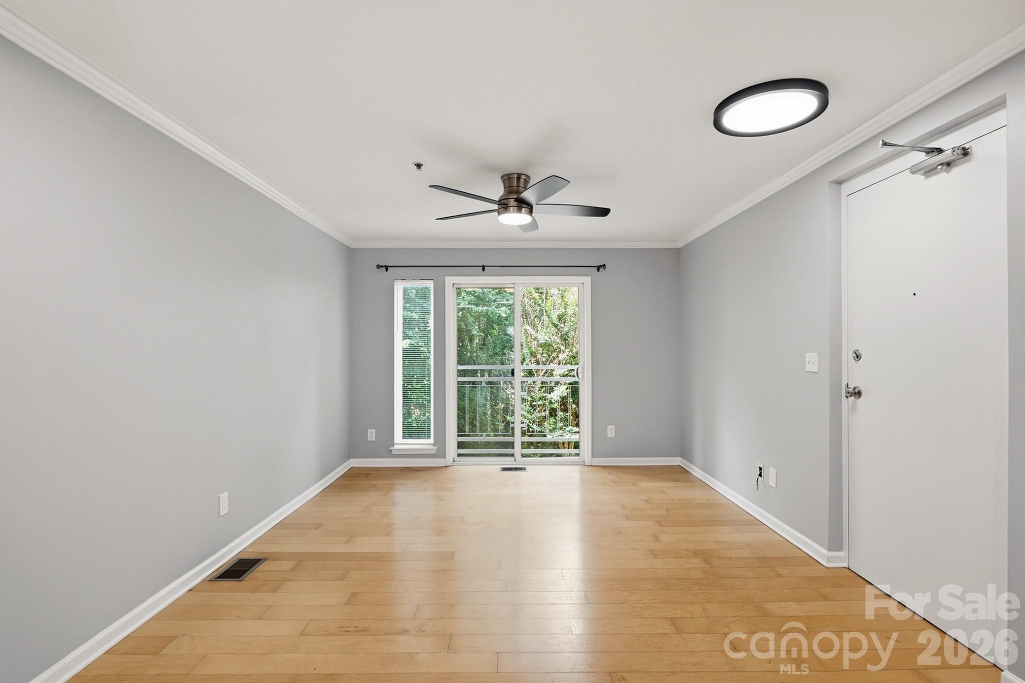 Welcome to your stylish retreat in the heart of Charlotte's vibrant Arts District. Located in the sought-after Renaissance community in NoDa, this beautifully updated 2-bedroom, 2-bath condo offers the perfect blend of urban convenience and modern comfort. Freshly painted throughout, with brand-new carpet and remodeled bathrooms, this move-in-ready home delivers a clean, contemporary aesthetic that you are seeking.

Step inside to discover an open-concept layout filled with natural light, beautiful flooring, and a seamless flow between the living, dining, and kitchen spaces. The kitchen features granite countertops, stainless steel appliances, ample cabinetry, and a breakfast bar that makes entertaining effortless. Large windows and French doors open to a private Juliet balcony overlooking mature trees, creating a peaceful escape while remaining just minutes from Charlotte's hottest destinations.

The flexible floor plan features two spacious bedrooms, with a private lower-level primary suite complete with a walk-in closet and a beautifully updated ensuite bath. Whether you're working from home, hosting guests, or simply enjoying everyday living, this layout offers comfort and functionality in every square foot.

Residents enjoy exclusive access to the community pool, recreation areas, beautifully landscaped grounds, and convenient parking. Situated just moments from NoDa's renowned restaurants, breweries, coffee shops, art galleries, live music venues, and the LYNX Blue Line Light Rail, this location puts the very best of Charlotte right at your doorstep. The Renaissance community is known for its proximity to the Arts District and walkability to local attractions, dining, entertainment, and transit options.