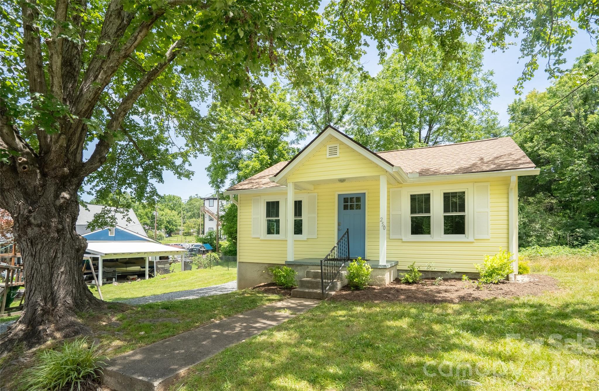 Welcome to 250 Oakdale Street, a beautifully renovated bungalow in the heart of downtown Brevard, now offered together with an adjoining vacant lot! Taken down to the studs and completely updated in 2023, this 2 bedroom, 1 bath home blends modern comfort with timeless character. Inside you will find fresh Sheetrock walls, stylish shiplap ceilings, and durable luxury vinyl plank flooring. The spacious bathroom features a double vanity, and the kitchen offers room to add a small work island, perfect for meal prep or morning coffee. A bonus room rounds out the interior with flexibility for a home office, pantry, or extra storage. Out back, a sunny deck is ideal for grilling or relaxing while overlooking the backyard. A rear yard drainage system was added in 2024 to keep water moving away from the home, a smart upgrade that gives buyers added peace of mind. The walk-in crawlspace keeps bikes, garden tools, and outdoor gear neatly tucked away. What truly sets this listing apart is the adjoining vacant lot. Whether you envision a lush garden retreat, a private ADU for guests or rental income, or an entirely separate home, the possibilities are wide open. A shared driveway is already in place. Buyers are encouraged to verify options with the City of Brevard. All of this just a short stroll from Brevard's local parks, shops, and restaurants. Downtown living at its best, with room to grow.