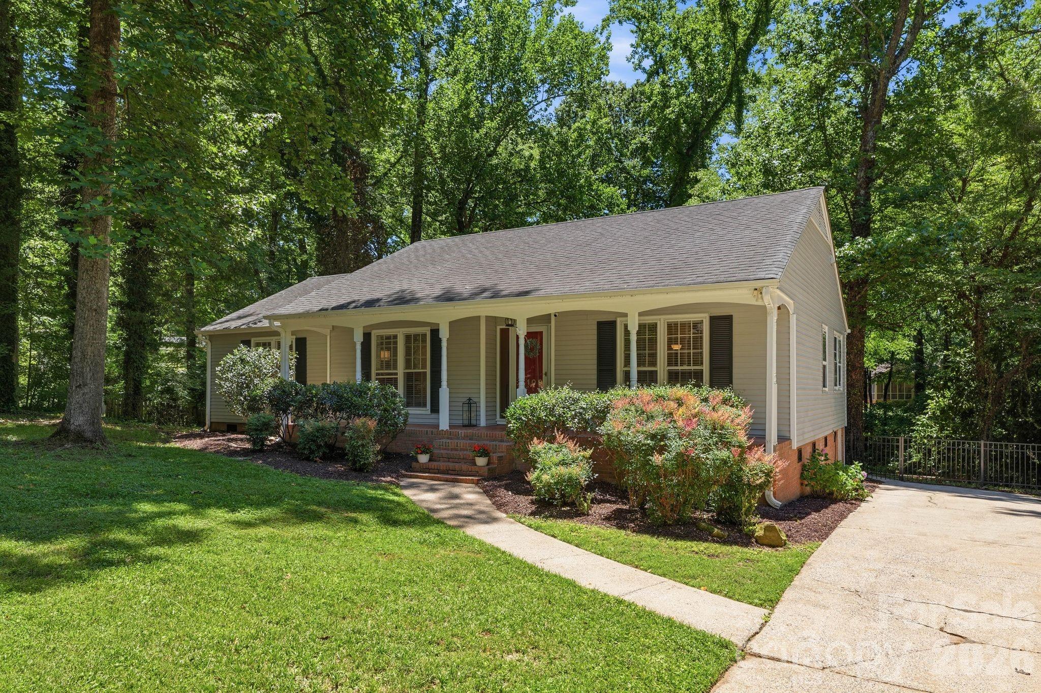 Welcome to this adorable ranch home just minutes from Southpark! Featuring 2 separate living areas, this layout is flexible for your lifestyle. The large front living room can accommodate a big sectional sofa and still offers a separate space for a sitting area/reading nook, office, or even a home bar. The kitchen featuring an island with farmhouse sink, quartz countertops, gas range and built in wine fridge opens to a large dining area and charming sitting room with fireplace. Double doors connecting the dining area to the large, private deck open up great entertaining possibilities. Both bathrooms have been fully updated from top to bottom and feature large vanities with quartz countertops. Interior walls are freshly painted. The deck overlooks the fenced backyard with large trees providing ample shade- a cooling respite in these hot summer months. Enjoy living in a quiet, well-established neighborhood yet having close proximity to all the great amenities of the Southpark area, Park Road Shopping Center, the Sugar Creek Greenway, etc. Easy access to Uptown and Charlotte Douglas Airport.