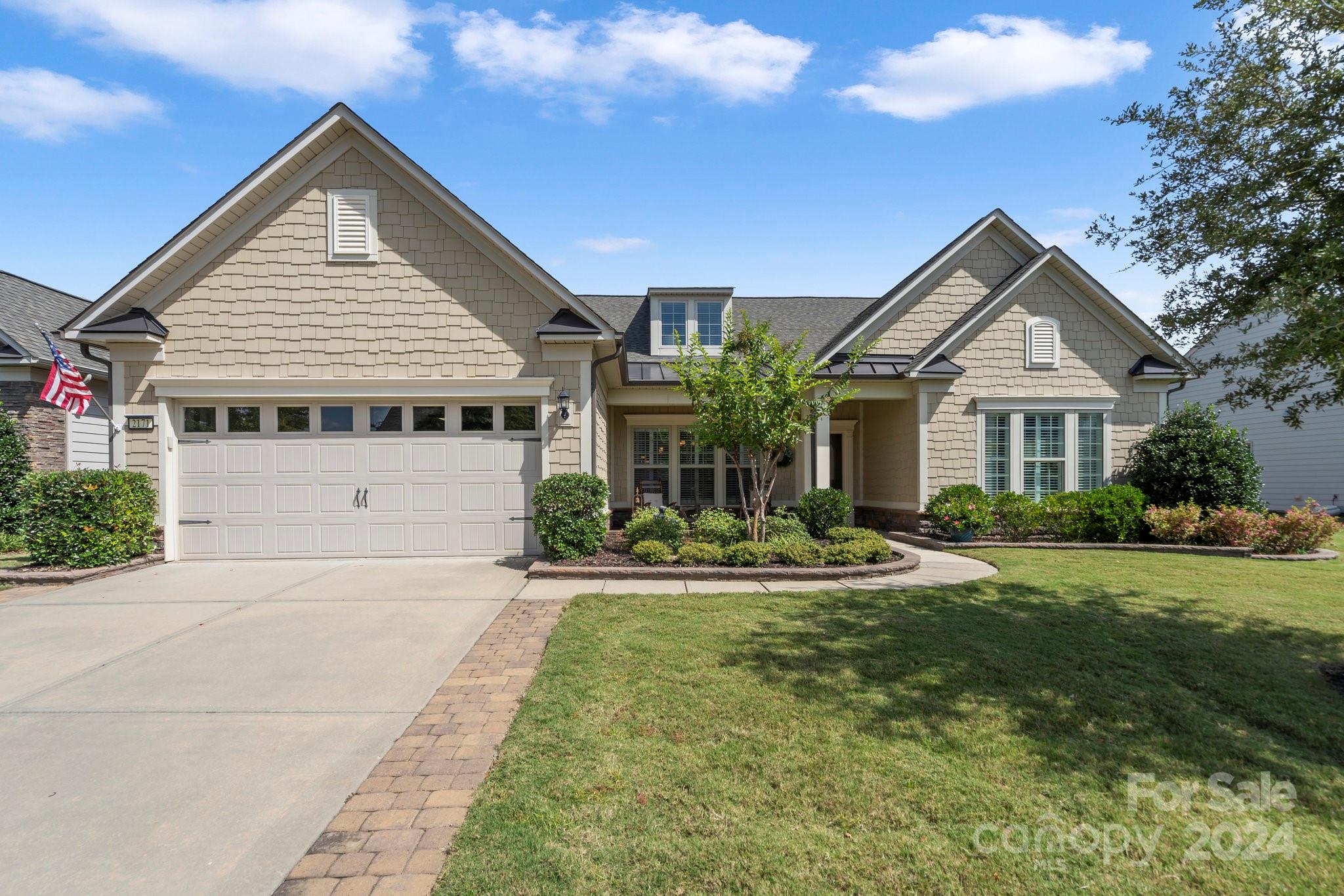 Enjoy this stunning home located in Carolina Orchards, a premier 55+ community in highly sought after Fort Mill, SC. This 1.5 story features 3 BR, 3 full & 1 half baths, Sunrm, Screened Porch overlooking a pond. Rocking chair front porch & screened back porch are the perfect getaway. Upgrades throughout. KitchenAid stainless apps, quartz counters, pull out drawers, walk-in pantry, under cab lighting, Primary Suite Bath has the spa-like walk-in shower. Laundry rm w/cabinets & sink. Great rm w/stone FP. Walk-in attic storage from the loft area. Drop zone to the tandum 4' ext Gar. Radiant Barrier sheathing for energy efficiency. Prof landscaped, irrigation. Amenity rich community includes indoor/outdoor pools & hot tubs, clubhouse, fitness center, ballrm, meeting rms, playground, dog park, 8 lit pickleball cts, 4 lit tennis cts. bocce cts, aerobic rm, full-time activities director w/lots of activities & clubs to choose from. Come join us in the Orchards. It's a great place to call home.