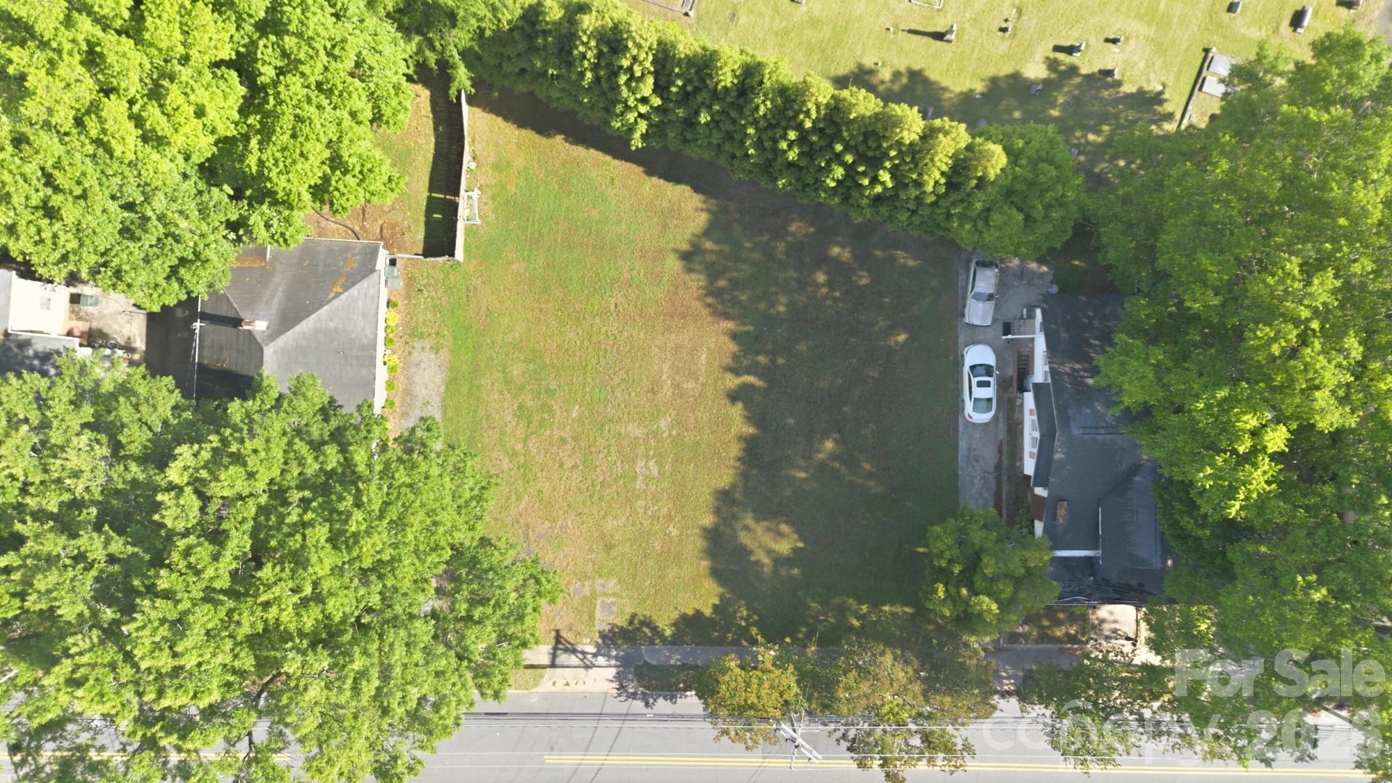 Wonderful opportunity to own a beautiful lot in the heart of Gastonia’s charming historic district. Enjoy being within walking distance to local shops, restaurants, and entertainment. The lot is cleared and features a lovely backyard with mature trees, offering a perfect setting to build your dream home. Any new construction is subject to approval by the York-Chester Historic District.