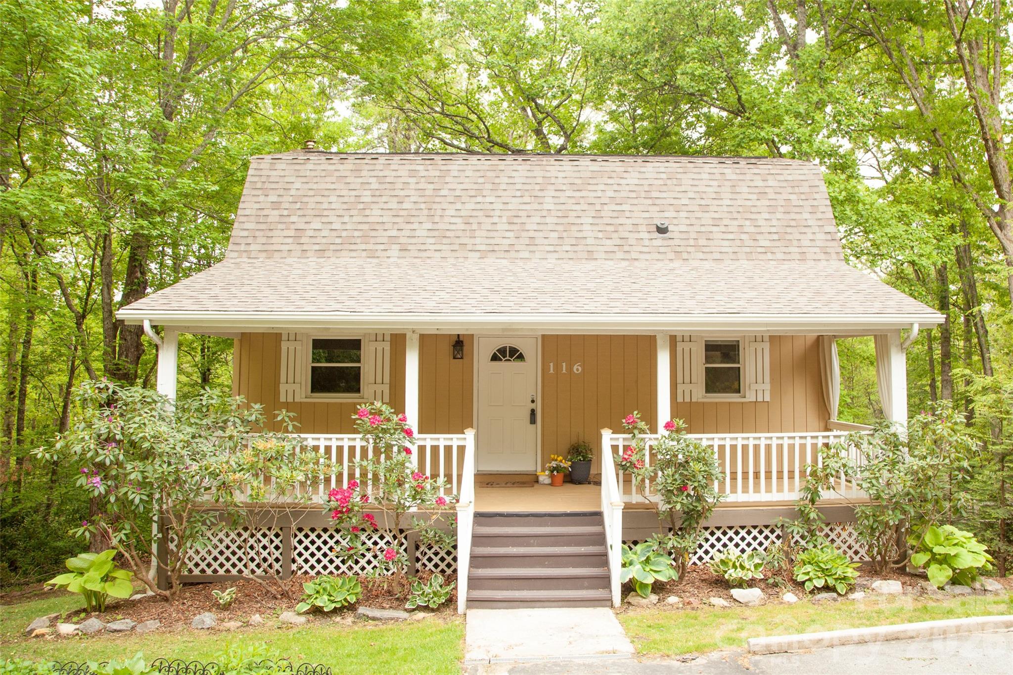Storybook Cottage with Income Potential on a Private Acre Near Asheville.  Just 20 minutes from downtown Asheville, this charming storybook cottage offers the perfect blend of mountain character, flexibility, and investment opportunity. Nestled on a lush, wooded one-acre lot, the property delivers the privacy and peaceful setting buyers crave, complete with a firepit for gathering under the stars.  The main home features convenient main-level living with a cozy fireplace anchoring the living space, while the fully furnished lower-level apartment offers exceptional versatility. With its own newly installed fireplace, the apartment is ideal for short-term rentals, long-term tenants, multi-generational living, or savvy house hackers looking to offset their mortgage.  Adding even more value is a detached 350-square-foot studio/workshop, perfect for a home office, artist's retreat, fitness space, or creative workspace.  Whether you're searching for a mountain getaway, an income-producing property, or a home with room to live, work, and create, this unique Fairview retreat checks all the boxes. Enjoy the serenity of nature while remaining just minutes from Asheville's restaurants, breweries, shopping, and outdoor adventures.