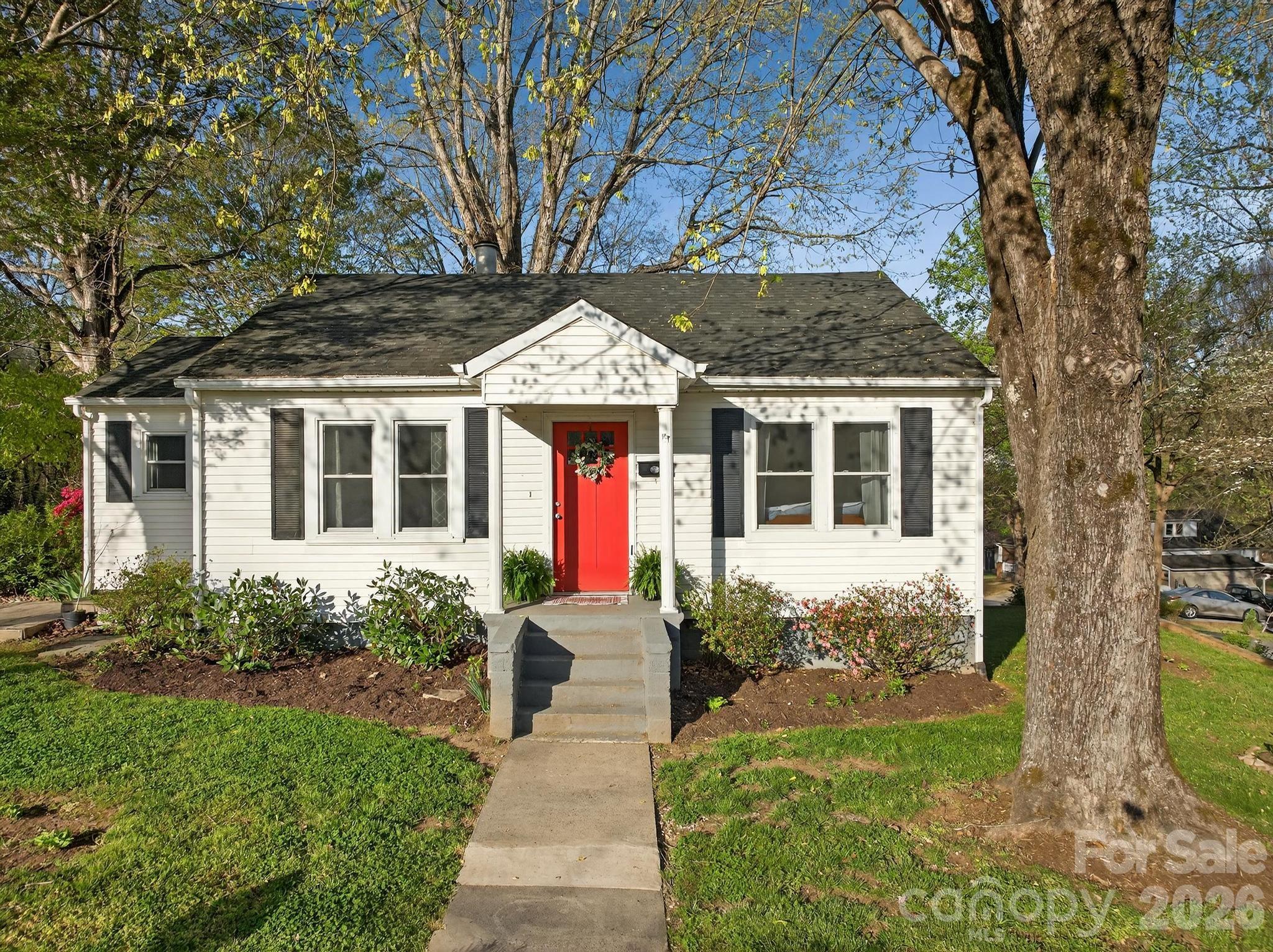 This delightful cottage blends warmth, character, and convenience into one inviting home. Rich wood floors run throughout, creating a timeless foundation, while the bedroom’s wood ceiling adds a touch of rustic charm that feels both cozy and distinctive. With three bedrooms and one bathroom, the layout offers flexibility for comfortable living, whether you're settling in or creating a welcoming retreat for guests.

Ideally situated just minutes from shopping, dining, and the heart of Lenoir, this home makes everyday living easy and accessible while still offering a sense of quiet escape. Connected to city water and sewer, with reliable power from Duke Energy, you’ll enjoy modern conveniences alongside classic cottage appeal.

Full of charm and perfectly placed, this is the kind of home that feels like a storybook beginning.New HVAC 2026 .Roof 2020.