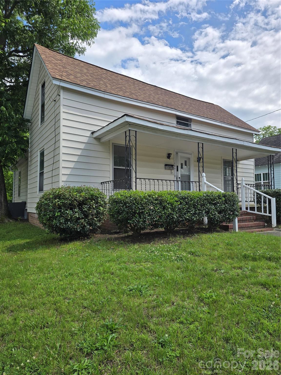 Rare opportunity to own a versatile property in the heart of Concord featuring two separate living spaces and built-in income potential. The main residence at 184 Cabarrus Ave E offers 4 bedrooms, 1.5 bathrooms, hard-surface flooring throughout, and a spacious covered front porch. Above the detached garage, the secondary dwelling at 182 Cabarrus Ave E features a private 1-bedroom, 1-bathroom apartment complete with its own kitchen, living area, bathroom, and abundant natural light.

Significant capital improvements have already been completed, including a new roof installed in 2025, HVAC systems replaced in 2023 and 2025, and a gas water heater installed in 2022, providing added value and peace of mind for the next owner.

The apartment is currently leased for $995 per month through June 30, 2027, creating immediate rental income potential. This unique property offers flexibility for investors, owner-occupants seeking supplemental income, multi-generational living arrangements, guest accommodations, or a private workspace.

Conveniently located just minutes from Downtown Concord, residents can enjoy easy access to local dining, shopping, entertainment, parks, and major commuter routes. Both residences convey with the sale, making this a truly unique opportunity in a growing market.