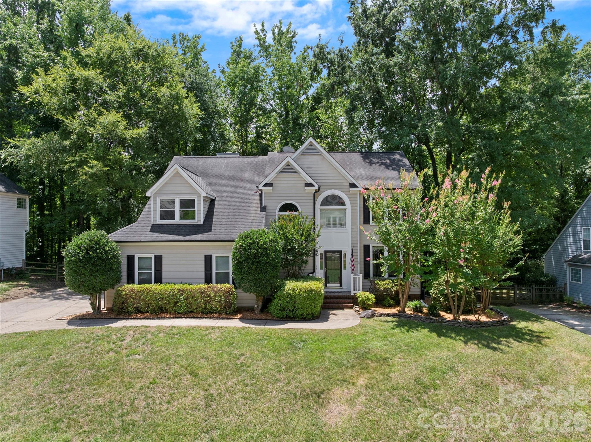 Spacious & open kitchen with granite countertops. New carpet with hardwoods thru most of main level & tile in bathroom. Freshly painted & more to see. Great outdoor space with nice deck that looks into flat yard with mature trees. Wonderful neighborhood amenities such as pool, tennis court, and pickleball. Birkdale Village within walking distance.