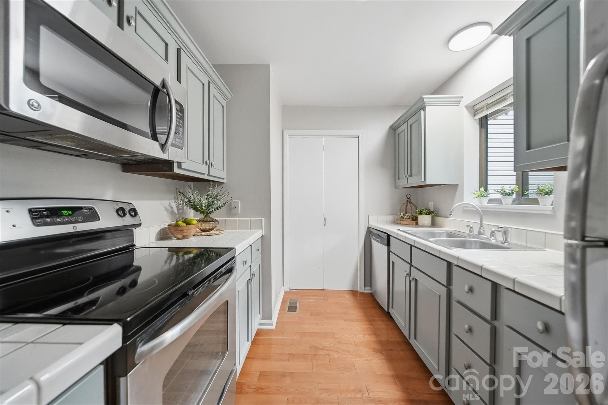 Rarely does a condo this updated, and this conveniently located become available in NW Hickory! Nestled just moments from shopping, dining, local parks, and the scenic River Walk, this move-in-ready 2-bedroom, 2-bath home offers the perfect blend of comfort, style, and low-maintenance living.

From the moment you step inside, you'll appreciate the bright, inviting feel created by the fresh 2026 paint, some updated fixtures, and beautiful prefinished hardwood flooring that flows throughout the home. The spacious floor plan features generously sized bedrooms with large walk-in closet, giving everyone plenty of room to spread out and stay organized.

The updated kitchen is both functional and stylish with freshly painted cabinetry, abundant storage, and convenient access to the laundry area. Enjoy your morning coffee or unwind after a long day from one of two screened-in porches—one located just off the living room and the other privately situated off a bedroom—offering peaceful outdoor living spaces rarely found in condo living.

Major exterior updates have already been completed with a newer roof (2022 +/-) and updated siding, providing added value and peace of mind. Whether you're looking for your first home, a place to downsize, or simply an easier lifestyle close to everything Hickory has to offer, this condo checks all the boxes.

Homes in this location and condition don't last long. Schedule your private showing today and discover why this one feels like home the moment you walk through the door. HOA is $175.00 includes pool, water, sewer and trash!!