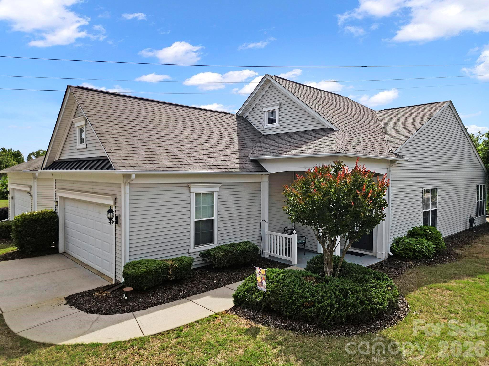 Welcome to this cozy & lovely 2 BR, 2 BA Fox Run model in the popular 55+ golf community of Sun City Carolina Lakes. A nice covered entryway creates a warm welcome as you walk up to the front door. 

At the front of the home, the kitchen offers abundant counter space, a center island, and a charming breakfast nook - the perfect setting for casual mornings or as a designated office area. The open-concept dining area, highlighted by an elegant chandelier, flows seamlessly into the inviting living room, creating an ideal space for entertaining and everyday living alike.

Just beyond the main living area, a bright sunroom boasts a stunning wall of windows that fills the space with natural light and offers peaceful views of the backyard. Whether used as a reading retreat, hobby space, or additional sitting area, this sunlit room is sure to become a favorite.

Tucked away at the rear of the home, the spacious primary suite provides a quiet retreat with backyard views. Double doors lead into the ensuite bath featuring a dual sink vanity and a glass-enclosed shower. The guest bedroom is privately situated near the front of the home with convenient access to a full hall bath, making overnight stays comfortable for family and friends. Additional features include custom lighting, undercounter lights, crown molding, newer roof-2020.

Step outside to enjoy warm Carolina days on the paver patio beneath the roll-out awning, perfect for relaxing or outdoor dining. Beyond the home, residents of Sun City Carolina Lakes enjoy an exceptional array of resort-style amenities including golf, tennis, pickleball, indoor and outdoor pools, fitness facilities, social clubs, a dog park, miles of walking trails and countless opportunities to stay active and connected. Make sure to join in on one or several of the many social groups Sun City is famous for. Conveniently located to local shopping, grocery, restaurants, banking & medical.