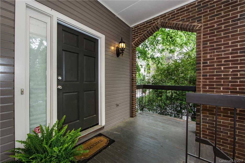 Almost 1600sf of living space Uptown! End-unit located on the park, not right on the street. Big covered porch, private, gated back patio...Walk to the Panthers, Knights -be in the center of Uptown in minutes. Also convenient to quickly growing West side, Pinkys, greenway & all that has to offer! Unit was just painted inside & out, & ready for you to come make it amazing. Tons of space, 3 BRs/2 full baths. Real hardwoods, high ceilings, beautiful setting, outdoor spaces-come make this one yours!