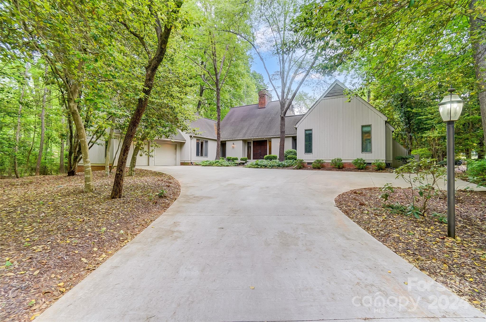 Fantastic opportunity to call the secure, gated community of River Hills your new home by the 14th Green! This 3 BR, 2.5 BA home is loaded w/ charm, offering hardwood floors, wooden beams, vaulted ceilings & a well-designed floor plan that maximizes its square footage. The kitchen boasts a combination wall oven & microwave, dining area, & a built-in desk w/shelving. Dining room is great for elegant dinner parties or casual gatherings. Spacious light filled great room features fireplace, access to outdoor living area, & glass French doors opening to flex area w/wet bar. Linger over morning coffee, read a book, or relax & enjoy the view from your sunroom, grill & entertain from back deck overlooking the golf course. Community amenities include: waterfront beach park, playground, community gardens, walking paths, 24/7 security, & dog park. Marina & Country Club available w/ separate fees offering golf, tennis, swimming pools. Clover Schools, SC taxes, convenient to restaurants & shopping.