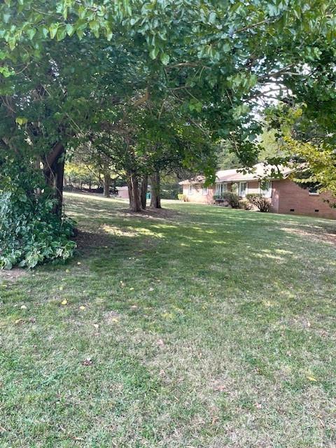 Great location in the Steel Creek area, close to the Rivergate shopping area.  Across from the Emergency Room. The property has a 2000 ft. brick structure.  Property has been rezoned for commercial use. Do not walk on the deck or bridge in the back yard. Walk the side road to the back of the property.

Property also listed under commercial MLS 4075404