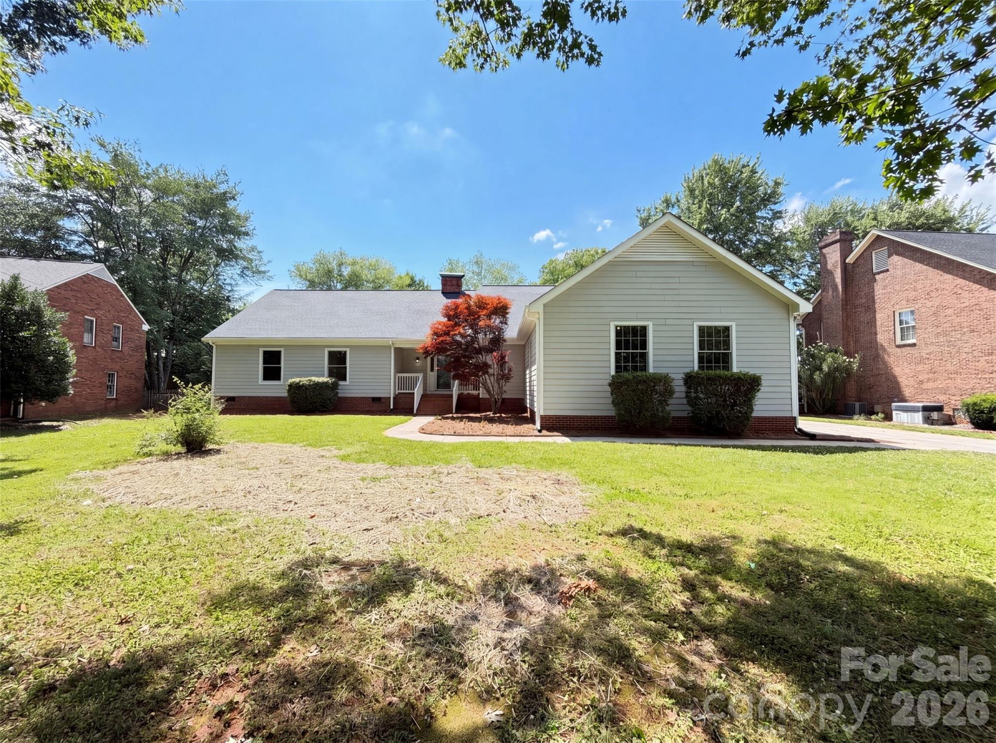 6505 Boykin Spaniel Rd is a one-story Charlotte home with practical features arranged for everyday comfort and easy use. The kitchen features granite countertops for durable prep space and a clean surface for meal preparation. A fireplace anchors the living area, adding warmth and ambiance to the main space. The primary bathroom includes double sinks plus a separate tub and shower for functional daily routines. A backyard patio extends the living space outdoors, creating room for seating, dining, or container gardening. The two-car garage adds parking and storage utility, completing a well-presented residence with useful amenities and comfortable function throughout.. Included 100-Day Home Warranty with buyer activation