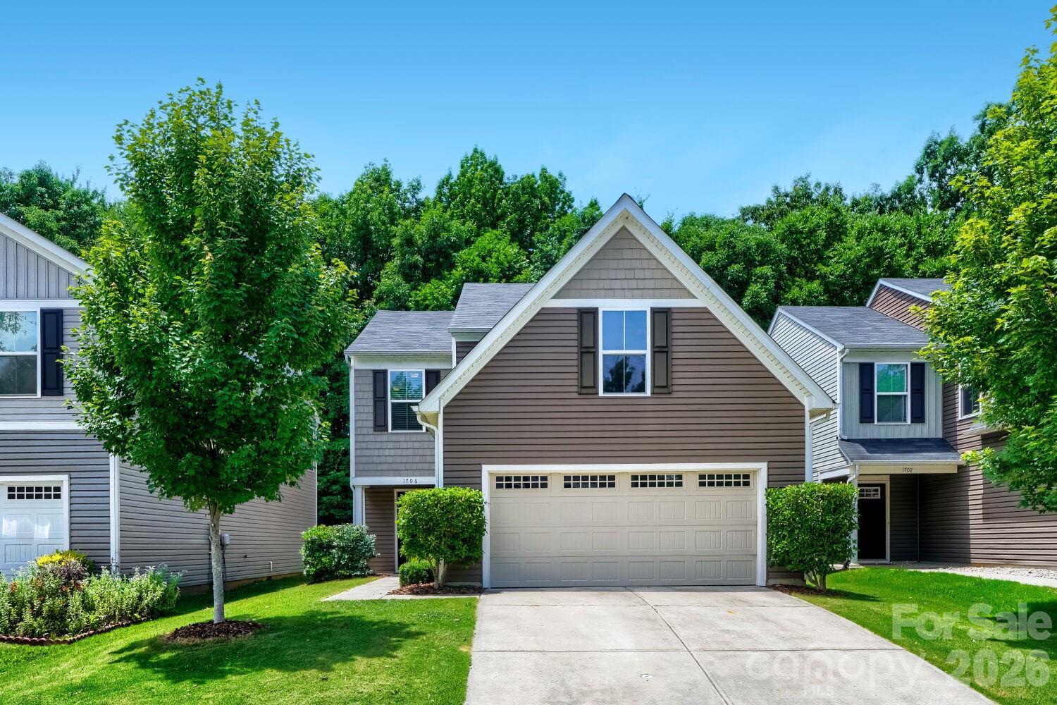 Welcome to this bright and spacious home in a prime Charlotte location! Featuring an open-concept layout with a gourmet kitchen boasting a large center island, stainless steel appliances, and abundant cabinetry. The main level includes a convenient powder room, and the dining area features doors opening directly to the oversized concrete patio and fully fenced backyard. Backing up to peaceful woods and a creek, this layout offers excellent privacy and nature right outside your door. Upstairs you’ll find a versatile loft (ideal for an office or play area), a large master suite with a walk-in closet and en-suite bathroom, plus two more generously sized bedrooms with ample closet space and modern bathrooms. Additional highlights include a 2-car garage, neutral finishes throughout, and easy access to neighborhood overflow/visitor parking. Located less than a mile from MoRA Point with shops, restaurants, and grocery stores. Just 15 minutes to Uptown and 10 minutes to Plaza Midwood. This move-in-ready gem offers the perfect blend of comfort, convenience, and outdoor living. For a limited time the seller is offering a $3,000 flooring credit. Don’t miss it!