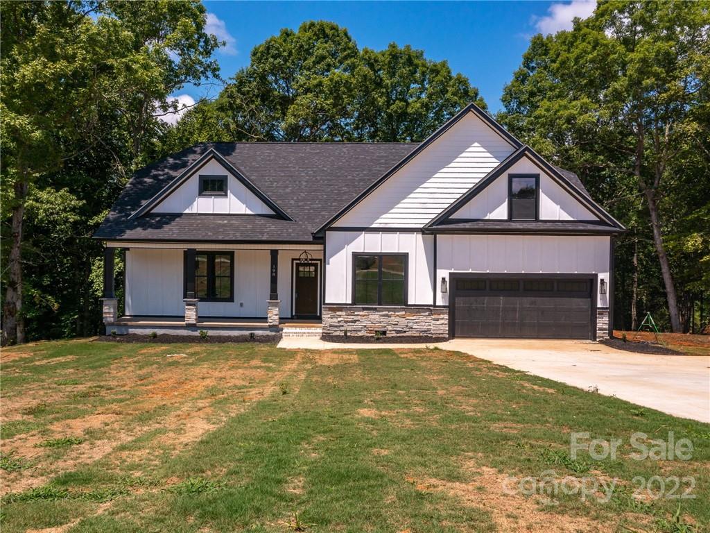 This rare Riverfront Home with 1.31 Acres situated on the Middle Tyger River! This incredible brand new construction is conveniently located just outside of Greer with less than a 20 minute drive to the Greenville/Spartanburg Airport or BMW. The Home features spacious bedrooms, (4 Bedrooms/3 Baths) 3 Bedrooms on the Main and 1 upstairs with a Bonus room as well. There is an open living room and  stunning kitchen that is great for entertaining. This home is gorgeously finished in the very desirable Tymberbrook community. LVP flooring in the living room, kitchen and hall on the main floor. Open Floor Plan has coffered ceilings, ventless fireplace, and covered deck just off the dining room. The kitchen has Quartz countertops. Enjoy sitting on the deck and listening to the birds in the trees and the flowing water of the Middle Tyger River.