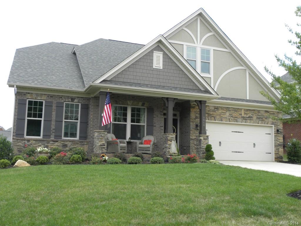 BEAUTIFUL MOVE IN READY full brick ranch style home with master and two spare rooms on main with two full baths and 2 bedrooms and or 1 bedroom/bonus with full bath up.  Open floor plan with gourmet kitchen granite, tile backsplash, maple chiffon cabinets with five burner gas cooktop and stainless steel appliances. Stunning distressed hardwoods throughout main level with plantation shutters and custom master closet. Nicely landscaped fenced in backyard with paver patio and covered porch.