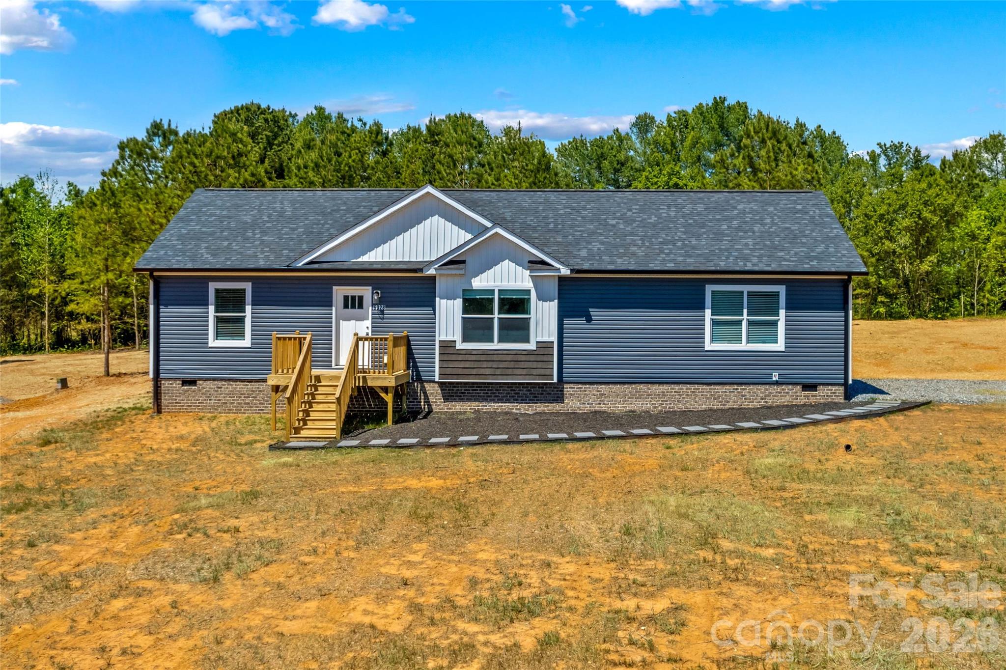 This 3 bedroom, 2 bath home was previously a model home for the builder and is now available for you to own, furniture included! You will love the open floor plan that makes entertaining guests a breeze. The kitchen is complete with island with breakfast bar, matching stainless appliances, tons of cabinet space, a pantry, and recessed lighting. Utility room has a built-in sink with cabinet storage. The spacious primary suite has a dreamy tiled shower with rain head system, dual sinks, and large walk-in closet. A roomy deck overlooks the back yard and is perfect for enjoying warm summer evenings. Amazing location that is convenient to shopping, dining, Lake Norman, and charming downtown Catawba.