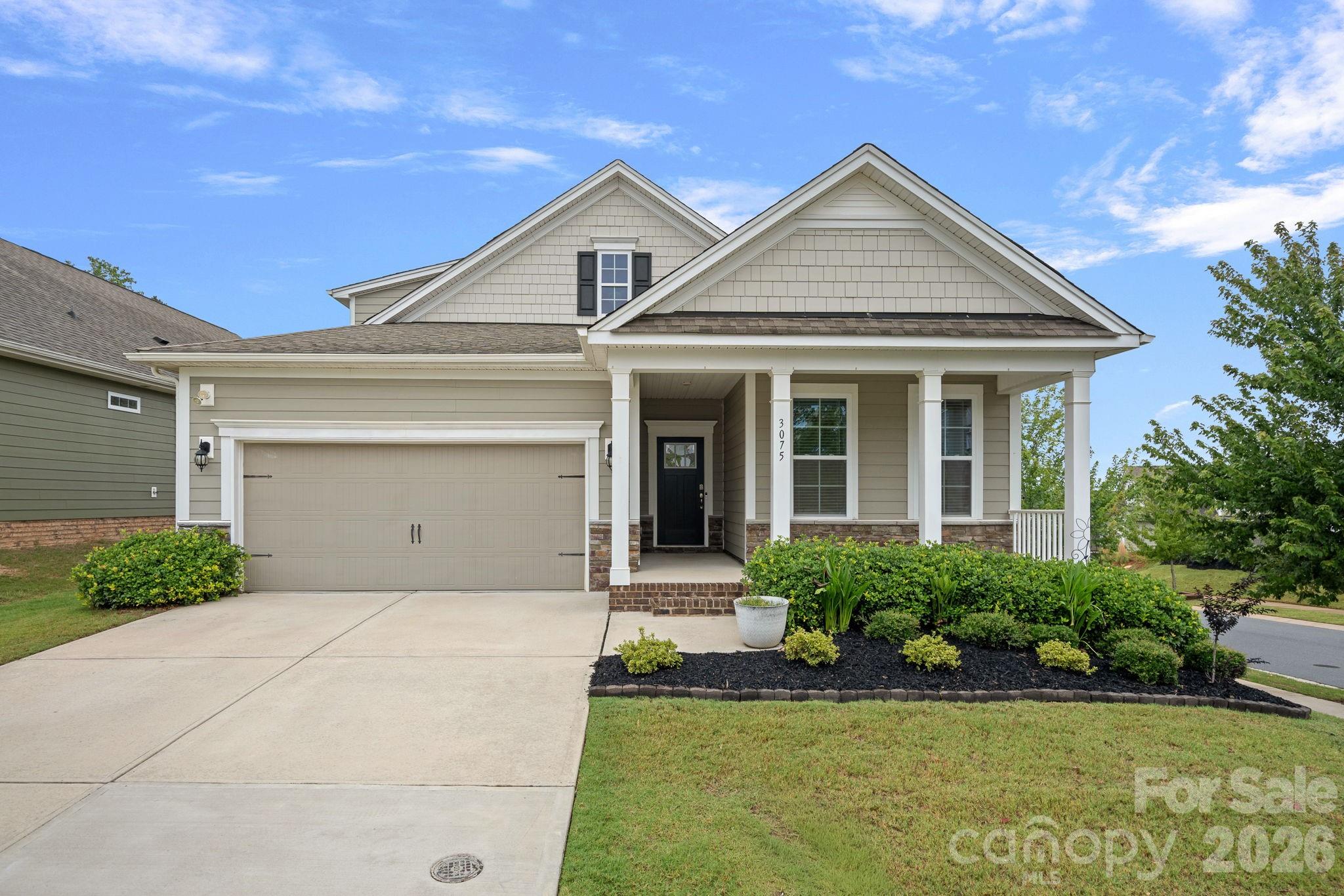 Welcome home to this beautifully maintained 3-bedroom, 3-bath home in the amenity-rich MillBridge community! Designed with comfort and flexibility in mind, this thoughtfully crafted floor plan offers primarily one-level living with an upstairs loft, private bedroom, and full bath - perfect for guests, a home office, media room, or multi-generational living.

The open-concept main living area features abundant natural light, a spacious great room with a cozy gas fireplace, and a well-appointed kitchen complete with granite countertops, stainless steel appliances, a large center island, walk-in pantry, and generous dining area. The private primary suite offers a spacious walk-in closet and an en-suite bath with dual vanities and a tiled walk-in shower.

Enjoy relaxing mornings on the covered front porch or unwind on the covered rear porch overlooking the landscaped corner lot. Additional features include a tankless water heater, attached two-car garage, and ample storage throughout.

MillBridge residents enjoy exceptional resort-style amenities including multiple pools, clubhouse, fitness center, playgrounds, walking trails, sports courts, and a vibrant calendar of community events all just minutes from charming downtown Waxhaw, shopping, dining, and top-rated schools.