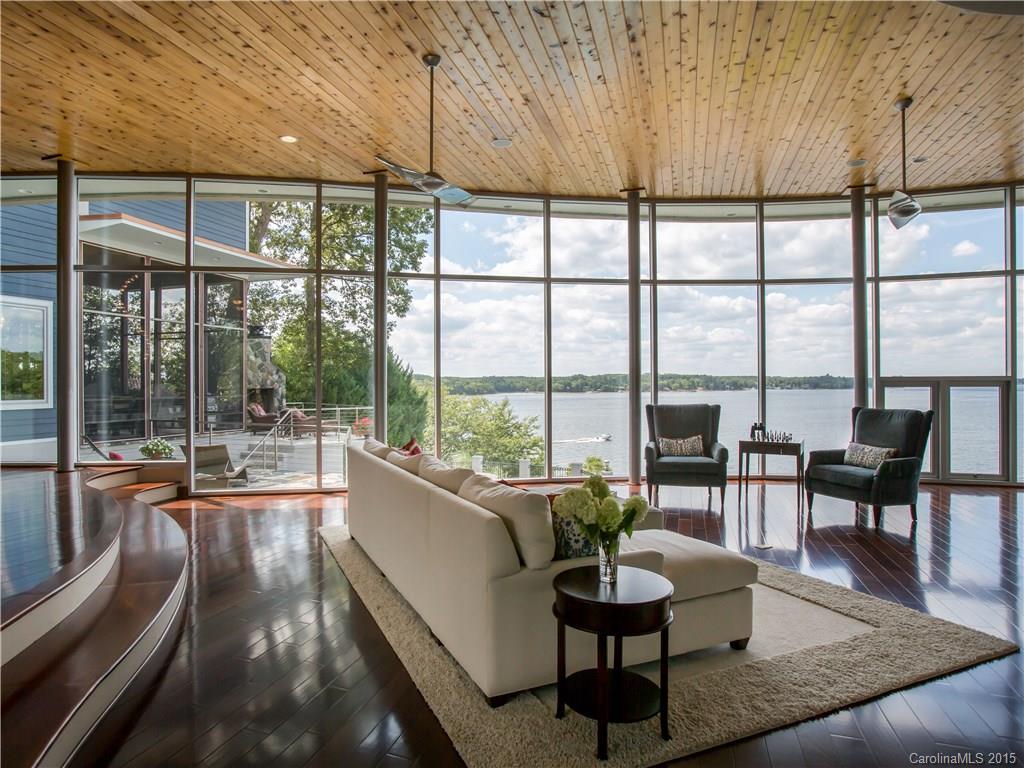 Dream Big. Big Water Views! Big Time Living! Feel like you're on vacation 365 days a year. There are few homes like this and rarely do they come on the market. Once in a lifetime opportunity to own an iconic modern masterpiece.   Wide open living space with five spacious bedrooms each with an ensuite bath.  Lots of fun in the "Fully Loaded"  Media Room w/ 3D projection. Heated pool and spa. Outdoor fireplace and grill + Dock with boat lift.  Great schools and small town easy living in Tega Cay.