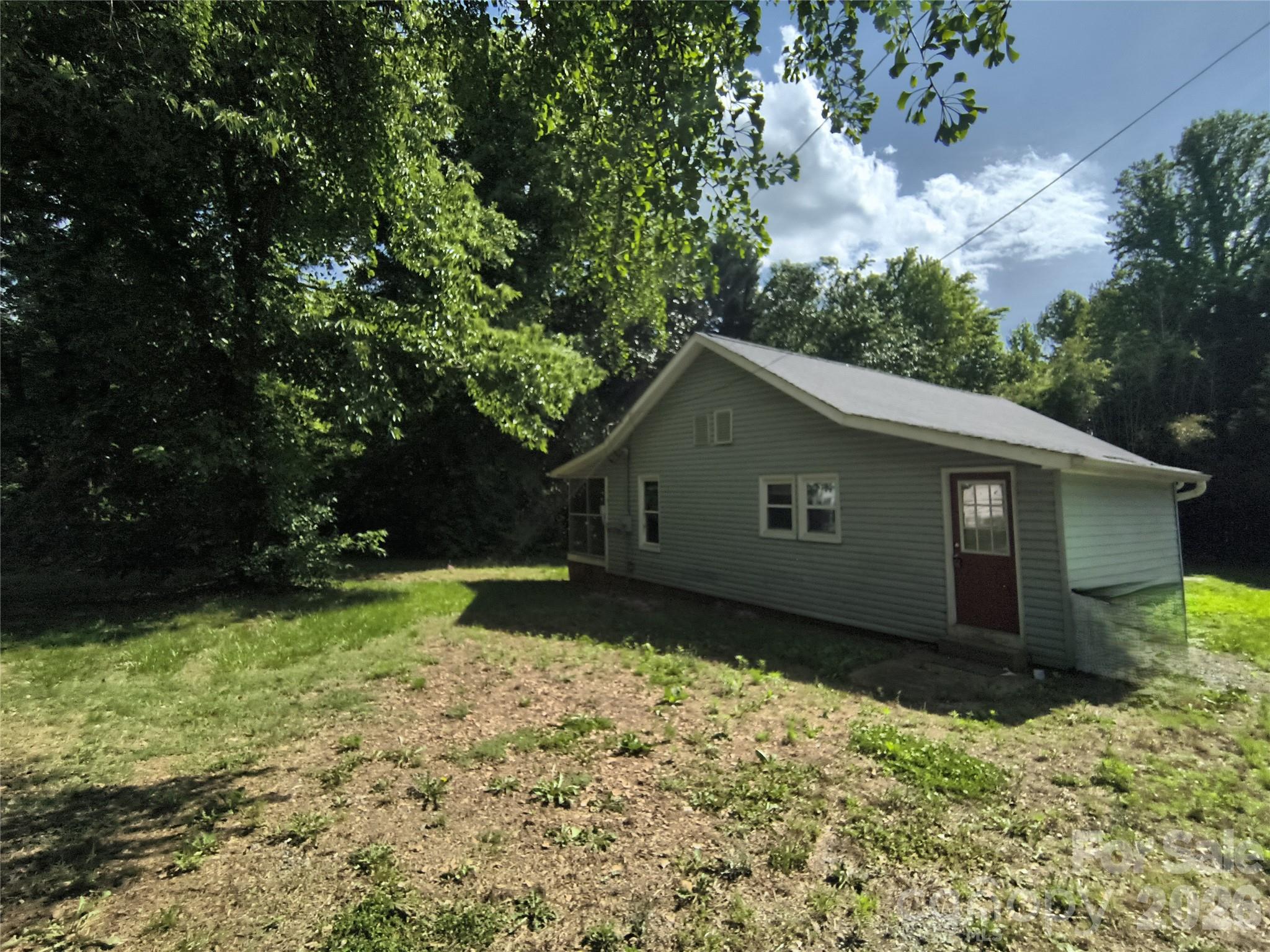 Not your average 3-bed, 1-bath—this one actually gives you space to breathe. Set on ~0.40 acres, it opens with a screened porch that practically begs for morning coffee or late-night unwinding. Inside is simple, functional, and easy to live in, while outside delivers extra room plus outbuildings for storage or projects. Quiet Ellenboro setting with quick access to Hwy 74, local shops, and nearby parks and trails.