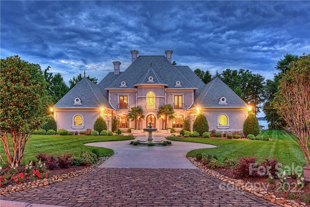 Elegant European style waterfront estate in exclusive gated community.  Features include library with built ins & copper tin ceiling, Chef's kitchen, screened porch, billiard/game room, media room, & surround sound throughout. Outdoor entertainers paradise including heated pool/spa with expansive deck, covered patio with several outdoor dining spaces, private sandy beach with built in fire pit, and private pier with boat lift.  Wine cellar with barreled ceiling and tasting room on lower level.
