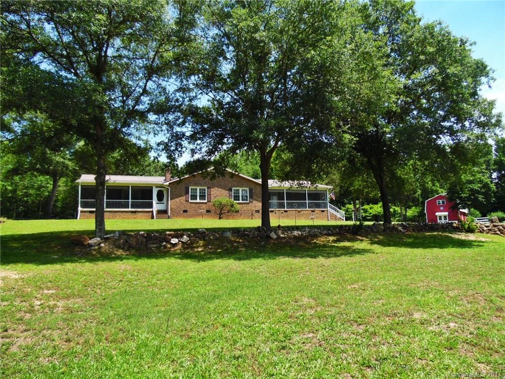 Escape city life & retreat to this beautiful 3 BR/2 BA brick ranch located on 7 picture-perfect acres w/2-story barn/workshop w/1300 sq ft, fencing, RV parking & detached garage w/472 sq ft studio apartment! Main house features formal dining, spacious family room with stone fireplace, huge master suite & multiple screened porches for enjoying the quiet country surroundings in all seasons. A rare find, this unique property offers the best of nature & the simpler life – and it could all be yours…