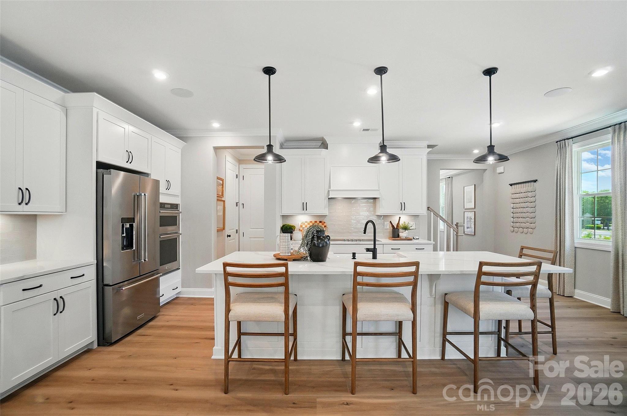 New Luxury Brick townhome in prime Ballantyne residential location!  The Caswell floor plan is spacious, functional and well appointed. Upon entering, you notice elegant features in the foyer including a Tray Ceiling and ext. Millwork. The large open living area features wide plank flooring, a Gourmet Kitchen with huge island, Kitchen dAid appliances, 42" White cabinets w/soft close, pull out shelves,
under cab. lights, Farmhouse sink, and Quartz.  4 bed/3.5 bath including 2 Lg. Primary Suites w/ sitting areas, en suite baths w/ tiled shower, and 2 walk in closets in 2nd floor Primary!  The home is filled with light from an abundance of recessed lights and beautiful trimmed windows.  9 ft. ceilings, 8' doors on 1st and 2nd level, Crown Molding and 2" faux wood blinds throughout the home are a few of the upgrades that enhance this home.

Only 6 homes remain in this exclusive boutique community of 28 townhomes!
Price includes all upgrades and homesite premium.