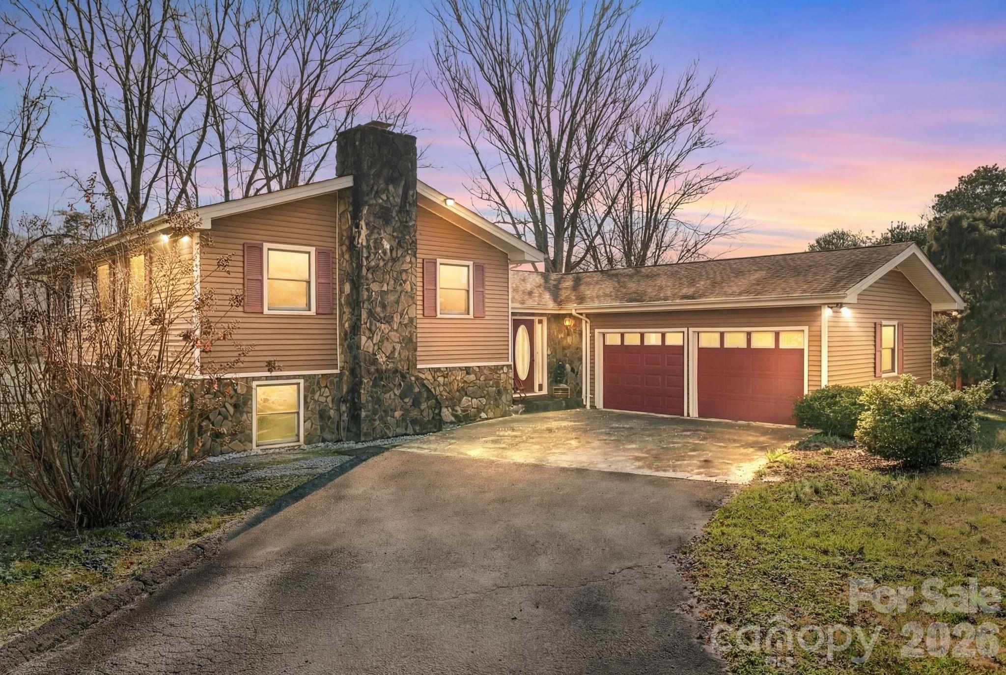 WALK TO THE PARK! Fully renovated in 2007 with new custom kitchen, imported wood beams, plumbing, engineered hardwood floors, enlarged the master bedroom and built the lower bonus/safe room. You'll love the way this home flows! Up six steps, and you have the enormous master bedroom w/full bath and large, spacious walk-in closet, another full bath and 2 bedrooms. Downstairs is an additional family room, bedroom, full bath, laundry/mud room and a secure, block bonus/safe room. Downstairs could easily be renovated to an in-law quarters as there is a separate entrance to the back yard. Speaking of back yard, Fido or your kiddos will love having so much room to romp in the fenced back yard! Need room to tinker? You'll love all the space in the 30x40 detached metal garage/storage building complete with heating and air on one side. You can't beat this location! City water/sewer; dual zone plus dedicated minisplit in bonus room
