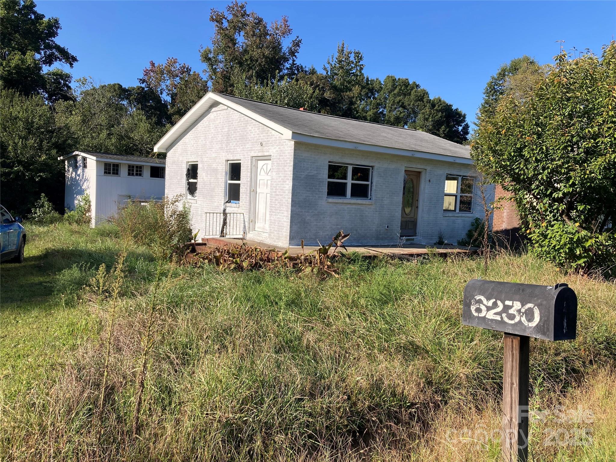 Bring your imagination and rehabbing skill. House is waiting for a buyer/contractor. Great location. Separate structure can also be rehabbed. Well needed. Some building materials left at the property.