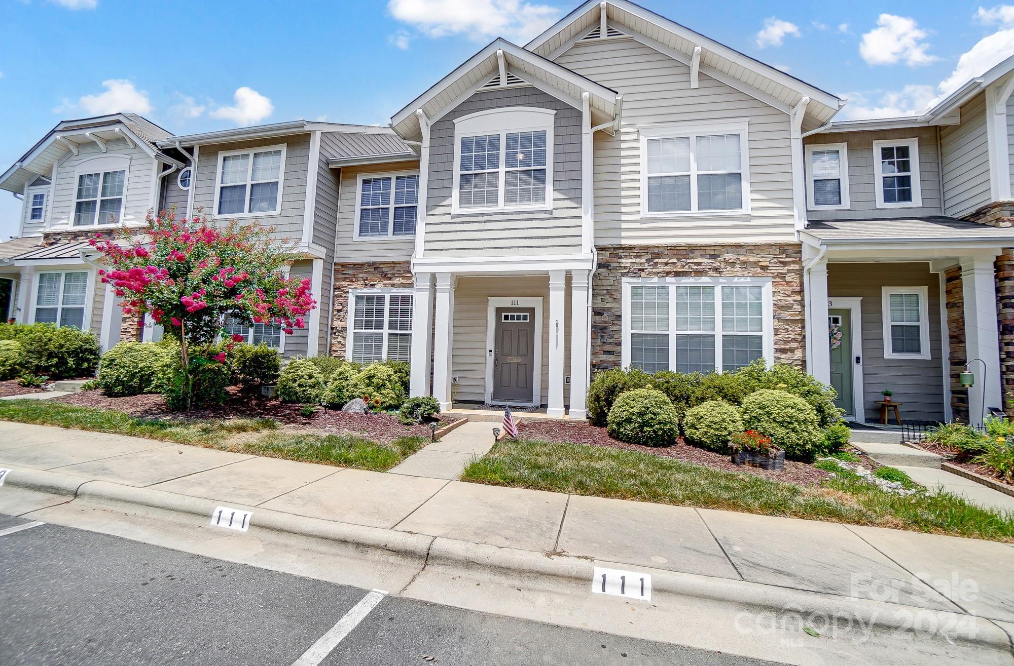 Popular Coventry townhome ready to move right in!  Stainless steel appliances & white kitchen cabinets with white subway tile.  Pantry, built-in microwave and smooth-top stove.  Refrigerator, washer & dryer to remain for buyers. Bright open floorplan with newer LVP flooring on the main level. Updated lighting fixtures.  Great room with cozy gas log fireplace.  Carpet upstairs & HVAC both new in 2020.  Walking distance to community pool. Roof replaced in 2011. Privacy enclosed brick patio & exterior storage. Covered front porch. Convenient sought-after Fort Mill community minutes from Lake Wylie, interstate access, shopping and Anne Springs Close Greenway!