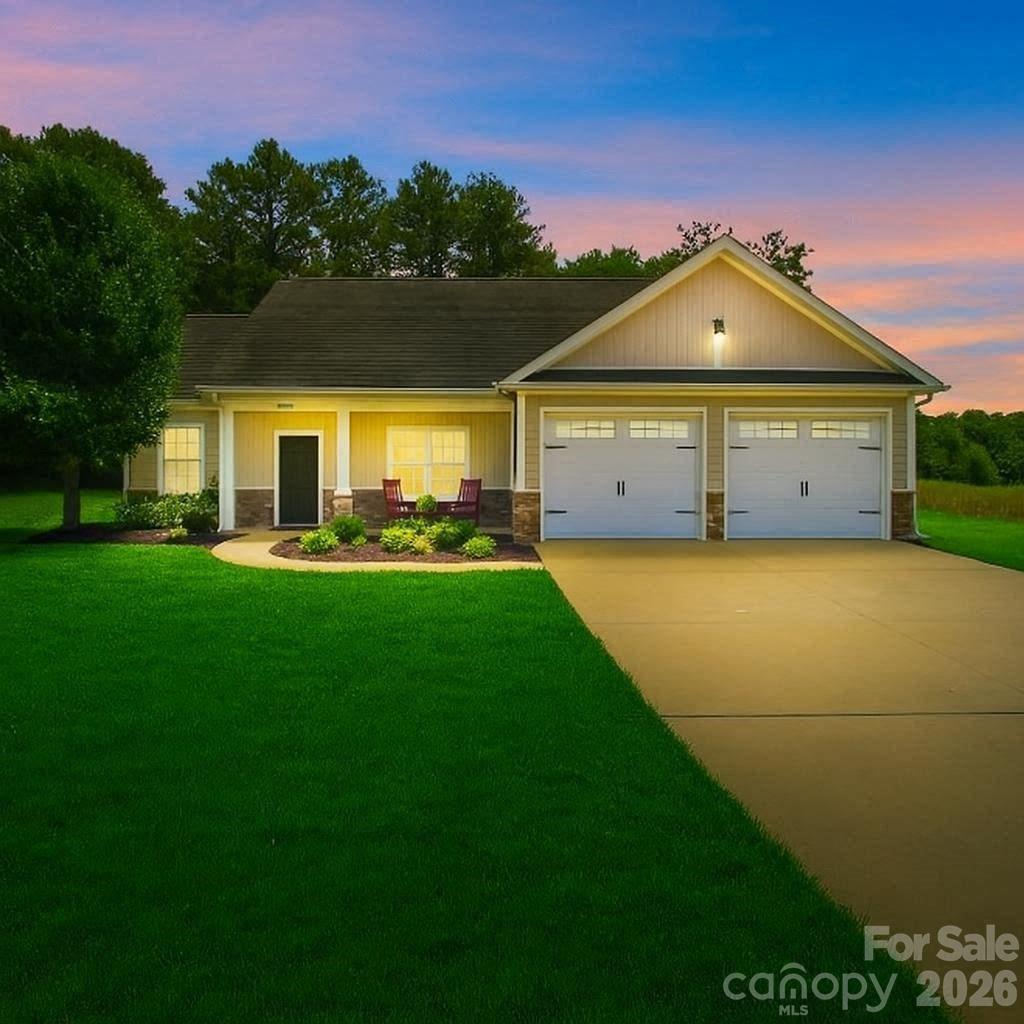 Experience the High Rock Lake lifestyle with the lake located steps away. This charming
one-story ranch home offers 3 bedrooms, 2 baths, a garage, and a spacious living area
designed for comfortable living and entertaining.
Relax with your morning coffee on the welcoming front porch or unwind in the screened-in back
porch, where you can enjoy the peaceful natural surroundings and wooded backdrop. Inside,
you'll find hardwood floors, granite countertops, abundant natural light, and a cozy gas
fireplace. The spacious primary suite features an elegant tray ceiling, a walk-in closet, and a private bath designed for comfort. Residents also enjoy
access to a community boat /trailer storage area, and boat ramp, making it easy to take advantage of
boating, fishing and recreation. Enjoy the perfect blend of comfort, convenience, and lake-area living. Don't miss your opportunity to enjoy lakefront living without the waterfront price tag. (New HVAC /A/C, Ceiling Fans and faucets).