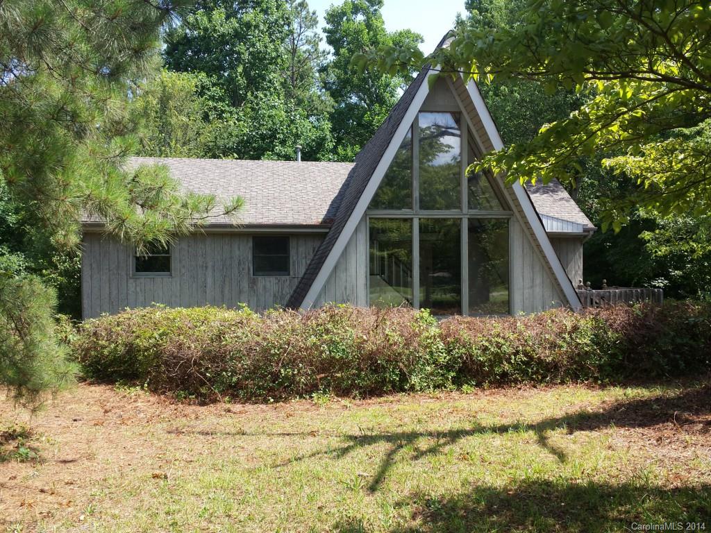 If you like individuality this home is waiting for you! This Rustic Charmer sits on a large lot & has some updates, but will need your special touches to make it fantastic. A Family Room w/ big windows for sun-lit days, exposed beams, & souring ceiling. Bright & Cheerful DR only a step to the kitchen, Well-Designed convenient kitchen w/ granite counter tops, Owner Suite w/ a full bath that is waiting for a make over, Two other airy BR's, and updated 2nd Bath. Make a date to see this one today!