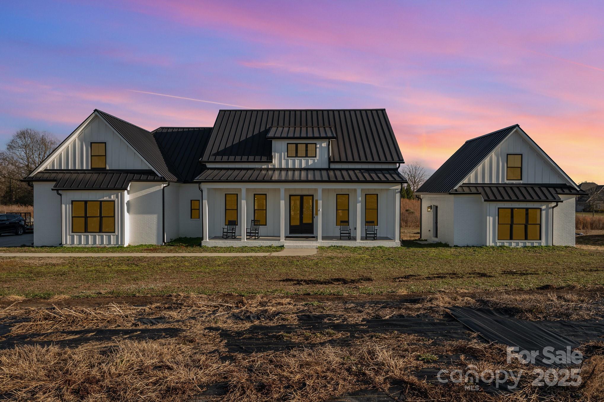 1/19 Open House Cancelled! Sitting on nearly 4 acres, this gorgeous custom Farmhouse features 3 spacious bedrooms, large bonus room & 2 bathrooms, along w/ a separate in-law suite complete w/ a full kitchen, living space, bathroom, & the option for a stackable washer/dryer! The main house showcases a chef’s kitchen w/ quartz countertops, soft close cabinets, a farmhouse sink, & a large butler's pantry. The primary suite offers a spa-like bathroom with a walk-in shower, clawfoot tub, & dual vanities. SO many custom touches throughout- butcher block counters, shiplap, & barn doors—the home also includes a bonus room upstairs, perfect for an office or extra bedroom, & attic storage! Enjoy your backyard oasis w/ a front porch & covered back porch, offering peaceful views of the surrounding land, which once housed wildflower beds, adding potential for your own outdoor projects! A 20’x26’ shed, dual septic, reverse osmosis well system, & ample parking further enhance this property’s appeal.