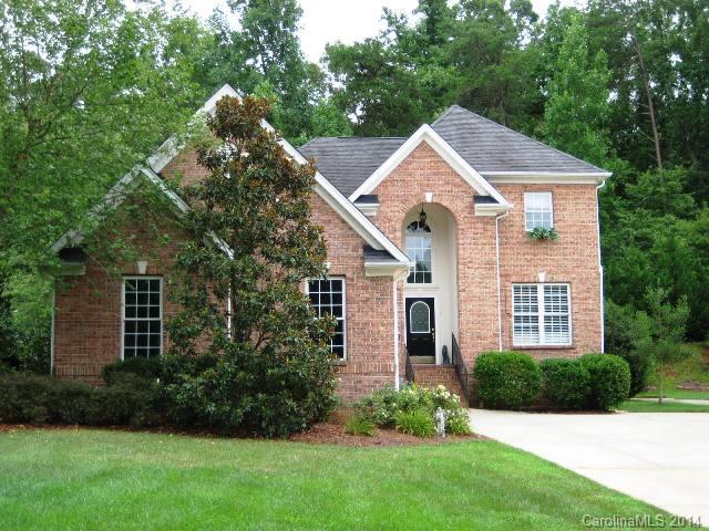 Low manintenance home with wooded backyard views, great deck for entertaining, Soaring ceilings,  curved walls, Spacious fm room with wall of beautiful windows, fireplace w/ gas logs, Hw Fls, large master downstairs master suite leads to sunroom, sapcious, sunny dining areas and upstairs bedrooms, Wonderful small neighborhood with great location near shopping! Excellent condition. Reduced $10,000 from original price. A lot of house for the money!