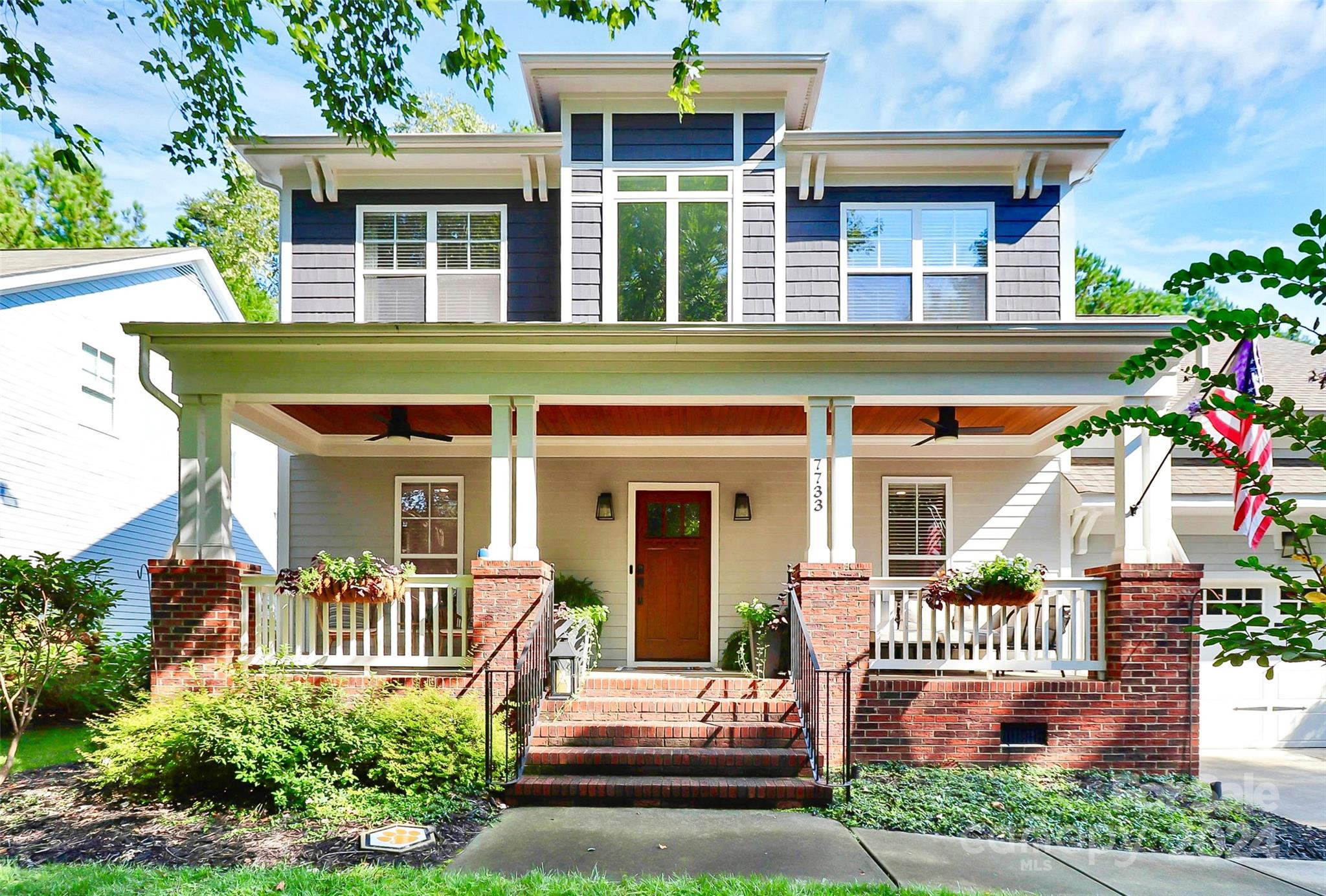 Welcome home! From the moment you arrive, the charming and cozy rocking chair front porch, complete with a beautifully crafted ceiling and custom front door, sets the tone for what lies inside. This home is filled with space and elegant details!

The highlight of this property is the fully fenced backyard featuring a stunning cobblestone patio, complete with an outdoor kitchen and custom fireplace. It's an ideal space for entertaining or simply enjoying the serene, private surroundings. The updated outdoor kitchen, featuring modern appliances, adds a sleek and contemporary touch. The primary bedroom on the main floor and the two story great room offers a peaceful retreat when you want relax inside.

Enjoy all that the community has to offer, including a beautiful lake, golf course, walking trails, marina, and pool. This home seamlessly blends luxury, comfort, and convenience—making it a place you'll never want to leave.
