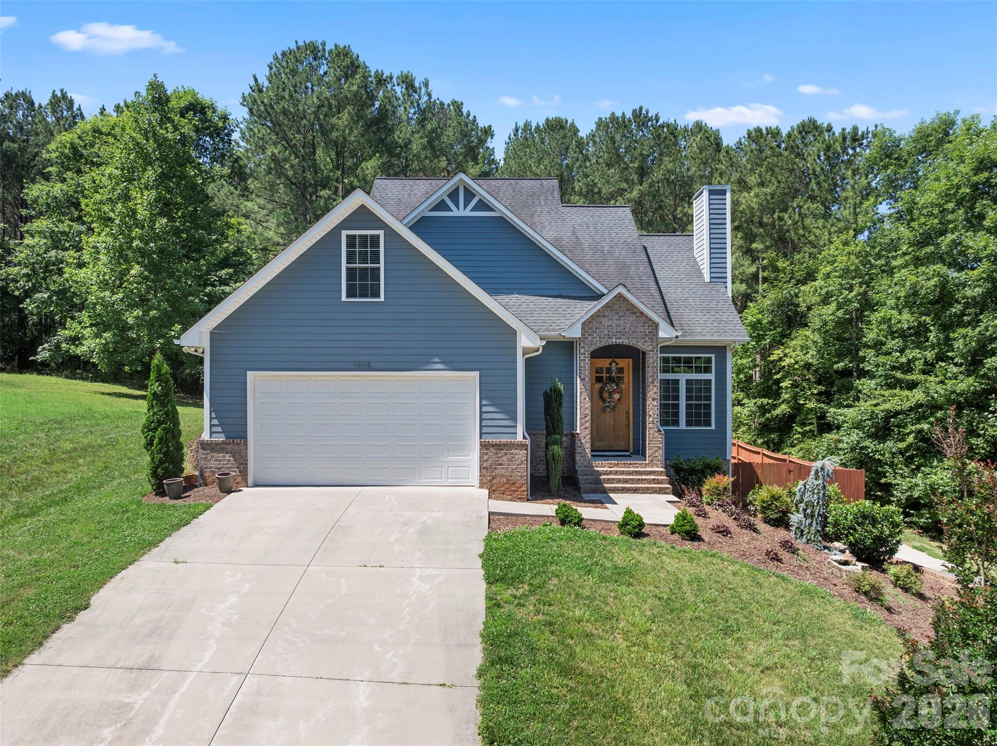 Welcome home to this beautifully maintained, craftsman inspired 3B/3.5B home in the desirable Grace Harbour community! Featuring a main-level primary suite, this home offers a blend of comfort and convenience. The spacious kitchen is a true centerpiece with granite counter tops, stainless steel appliances, farmhouse sink, and plenty of space for gathering with family and friends. The finished basement adds over 1,000 square feet of additional living space, providing endless possibilities for a recreation room, home office, guest quarters, or media room. Step outside to enjoy the fenced in backyard, ideal for entertaining, pets, or simply relaxing on the back deck. Seasonal views of Lake Hickory add to appeal, offering a peaceful backdrop and a glimpse of the lake's natural beauty without the lakefront price tag. Conveniently located near major highways, shopping, dining, outdoor recreation, and lake access, this home combines functionality, charm, and sought after features in one exceptional package. Don't miss the opportunity to make it yours!