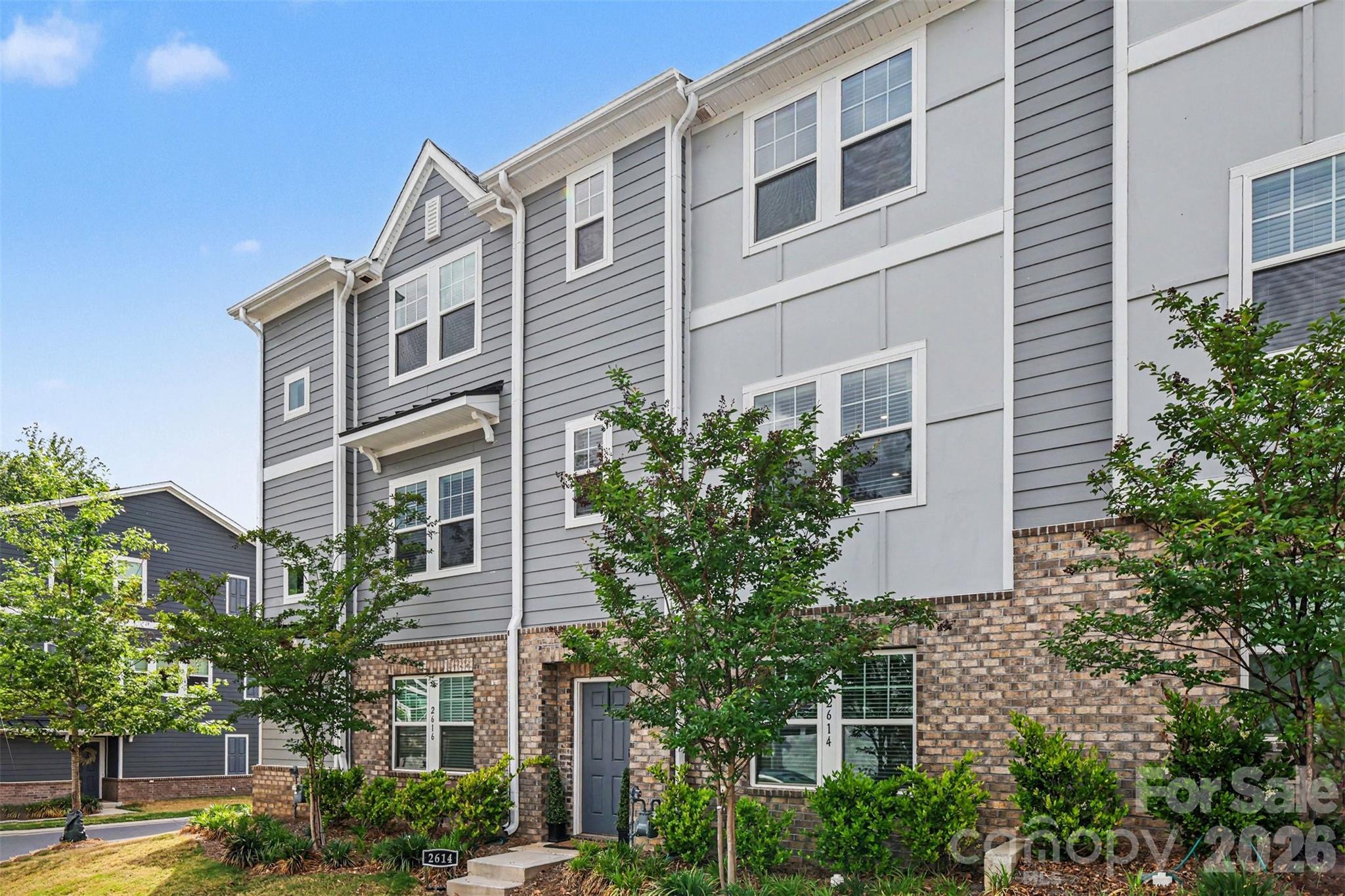 Modern comfort, effortless convenience, and a location that keeps you connected to the very best of Charlotte—this beautifully upgraded 4-bedroom, 3.5-bath townhome in Enclave at City Park offers a lifestyle that feels both elevated and easy. With the look and feel of new construction—without the wait—this meticulously maintained home delivers the perfect balance of style, function, and accessibility in one of the city’s fastest-growing areas.

Inside, the main living level was designed for the way people truly live today—open, welcoming, and filled with natural light. Wide-plank LVP flooring, expansive windows, and seamless flow between the kitchen, dining, and living spaces create an atmosphere that feels warm, modern, and effortlessly livable. The kitchen serves as the heart of the home, featuring a large gathering island, generous pantry, stainless steel appliances, and gas range—ideal for everything from slow weekend mornings to entertaining friends before a night out in the city. Just off the main level, the private balcony offers a peaceful outdoor escape for coffee at sunrise or unwinding at the end of the day.

The entry level provides incredible flexibility with a private guest suite and full en-suite bath—perfect for visitors, a quiet home office, fitness space, or multigenerational living. Upstairs, the spacious primary suite creates a calming retreat with a thoughtfully designed bath and generous closet space, while additional bedrooms provide comfort and privacy for family or guests.

Beyond the home itself, the lifestyle this location offers is what truly sets it apart. Imagine being just minutes from the energy of Uptown Charlotte, spontaneous dinners in South End and LoSo, morning walks through Charlotte Regional Farmers Market, quick access to the LYNX Light Rail for stress-free commuting, and effortless travel with Charlotte Douglas International Airport only moments away. Outdoor enthusiasts will also appreciate nearby Renaissance Park with its expansive green space, trails, and recreation opportunities.

Additional highlights include a rear-entry two-car garage, functional drop zone, abundant guest parking, and the low-maintenance lifestyle today’s buyers are searching for. Rarely does a home combine this level of turnkey condition, modern design, and true connectivity to Charlotte’s top destinations. This is more than just a home—it’s the opportunity to simplify daily life while staying close to everything that makes the city exciting.

LOW INTEREST RATE ASSUMABLE FHA LOAN IN PLACE UNDER 4%!!