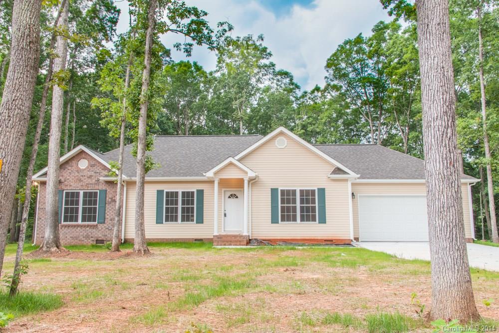 LAST ONE LEFT. This home is READY and waiting for you!!. Great home! Clover Schools and low county taxes. 1 acre and wooded. Brand New. 3 Bedroom 2 Bath, deck, split floor plan. Master has trey ceiling, custom handmade wood cabinets in all baths and kitchen. Stainless appliances. Call for info.