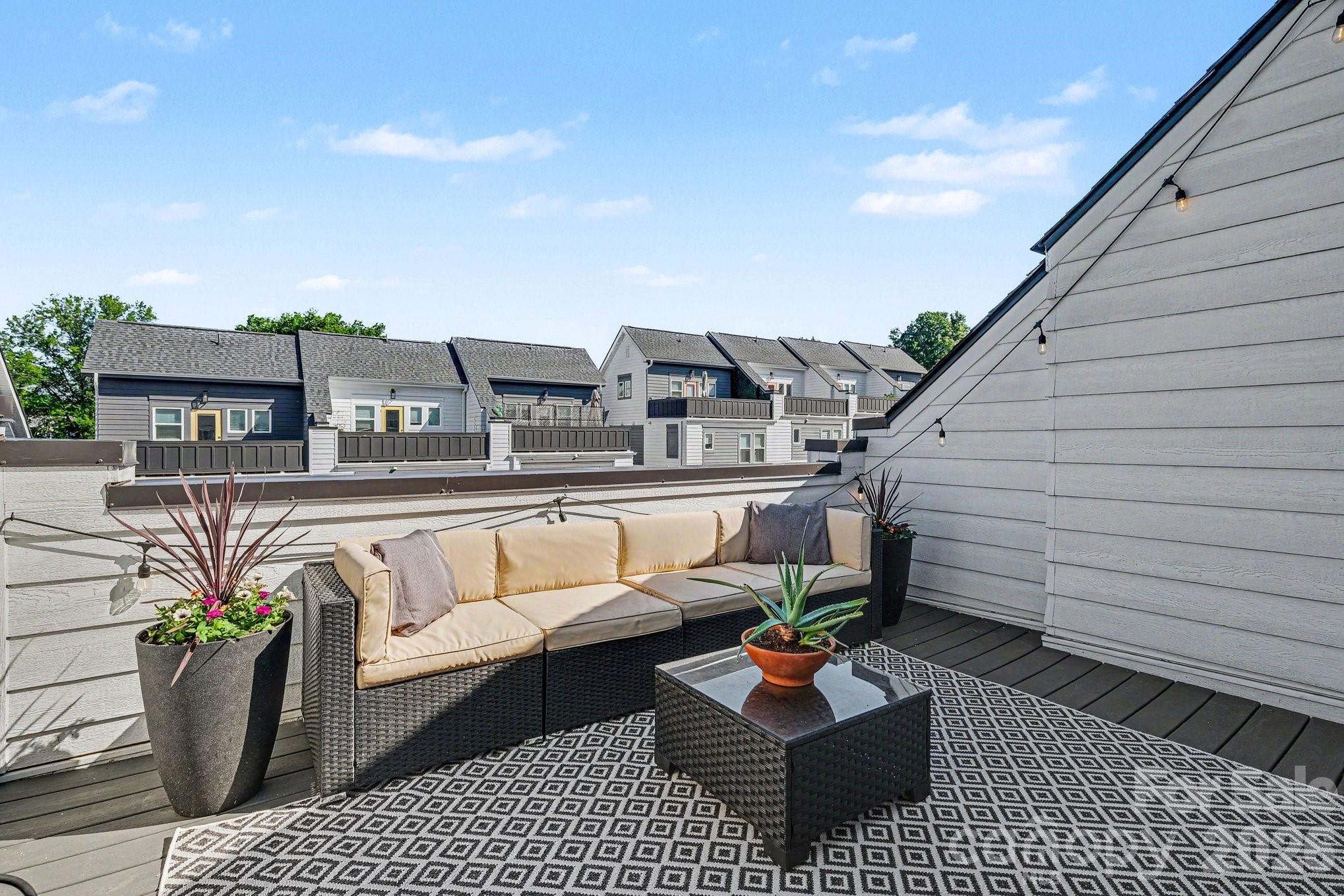 FULLY FURNISHED WITH ACCEPTABLE OFFER! Welcome to 562 West End, offering rare, year-round skyline views and a private rooftop terrace in the heart of Seversville, just minutes from Uptown, all on a quiet, low-traffic street. The main level features a modern, open-concept kitchen with quartz countertops, 42” shaker cabinets, subway tile backsplash and a large island, flowing seamlessly to an oversized sliding glass door with a natural, tree-lined backdrop. A Juliet balcony just off the kitchen is perfect for morning coffee or evening drinks. Upstairs, two well-designed bedrooms offer great natural light and functional layouts. The primary suite captures beautiful city views and features elegant lighting, double undermount sink vanity, and a tiled shower for a clean, spa-like feel. The guest bedroom includes a walk-in closet, providing excellent storage and flexibility for guests, a home office, or both. Ideal as an office, second living area, or guest space, the top floor offers a flexible living space with a half bath and direct access to the rooftop terrace, perfectly positioned for sunset views. Additional highlights include a 2-car attached garage, a transferable 10-year structural warranty with 6 years remaining and HOA fees covering water/sewer, master insurance policy, trash/recycling, exterior home and landscape maintenance. Located near greenways, light rail, parks, and the best of Lower Tuck, Wesley Heights, and Uptown, this home combines privacy, views, and convenience in one of the area’s most desirable pockets offering incredible value.