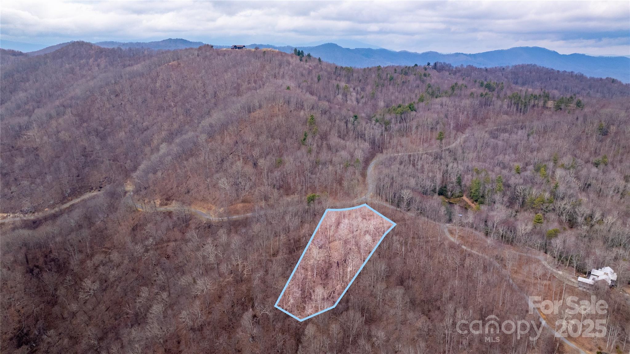 Embrace mountain living on Lot #14 of Grasslands Parkway, a 2.98-acre parcel in The Preserve at Little Pine (now Grassland Mountain Preserve), Marshall, NC. Surrounded by 1,800 acres of preserved wilderness, this property is near a stocked pond, offering a peaceful retreat for outdoor enthusiasts. Enjoy exclusive community amenities, including an equestrian center, an observatory, and a mountain lodge with breathtaking views from over 4,000 feet. Residents also have access to the W.C. Ward Pavilion & Pond, extensive hiking and UTV trails, and shared privileges at French Broad Crossing. Just 19 miles from Asheville, this lot offers the perfect blend of privacy, nature, and modern conveniences. Create your dream home in this one-of-a-kind mountain sanctuary.