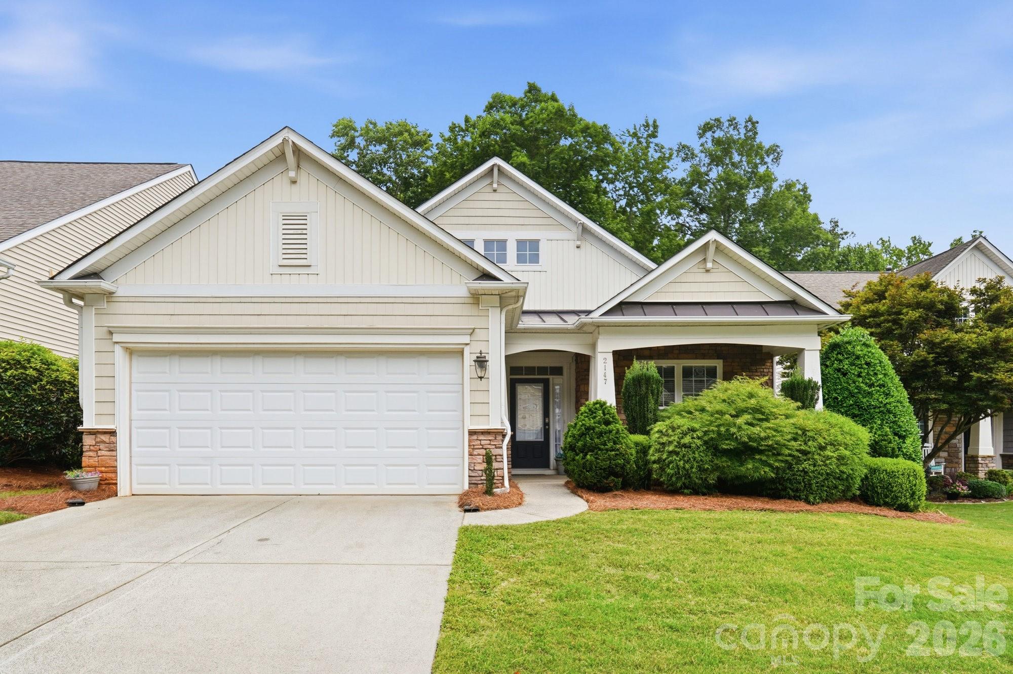Welcome to Lawson! Enjoy low-maintenance resort-style living in this beautiful ranch home, nestled in an amenity-filled community featuring swimming pools, tennis and pickleball courts, nature trails, a fitness center, and a clubhouse—with lawn maintenance included! This versatile home features a split-bedroom floor plan, including a spacious flex room perfect for a 3rd bedroom or home office. The open-concept living area boasts high ceilings and a cozy gas-log fireplace. Step outside to unwind on your covered, screened-in back porch, or host a cookout on the deck in your private backyard, which backs directly up to the community greenway. Additional highlights include an oversized, finished 2-car garage with pull-down attic stairs - great, spacious storage! Major updates offer ultimate peace of mind: a brand-new architectural shingle roof and fresh plush carpet with an upgraded pad (June 2026), water heater replaced January 2023, and HVAC system in 2021. Located on a quiet cul-de-sac just seconds from one of several community nature trail entrances, and only minutes to shopping, dining, and historic downtown Waxhaw!